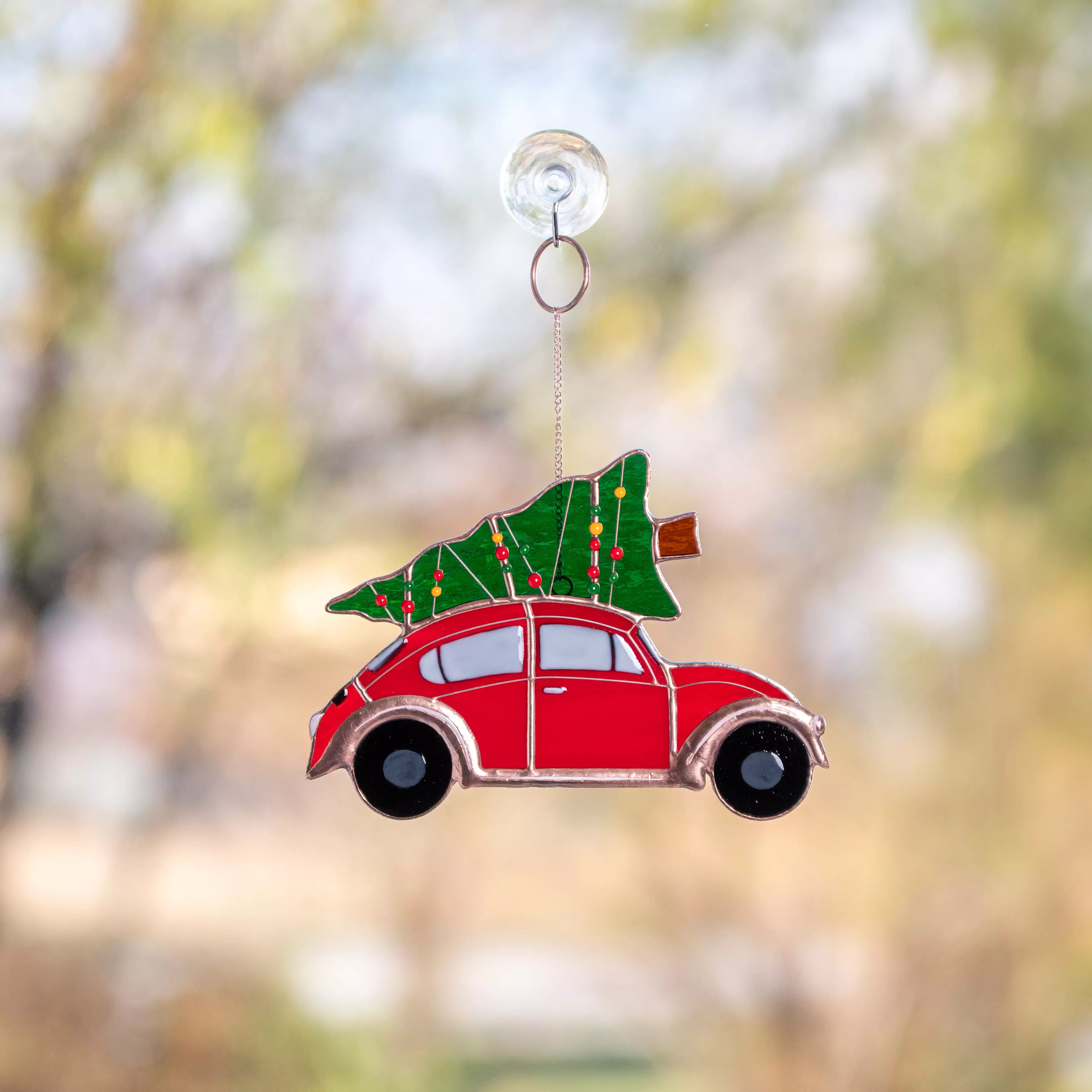 Stained glass suncatcher car with a Christmas tree