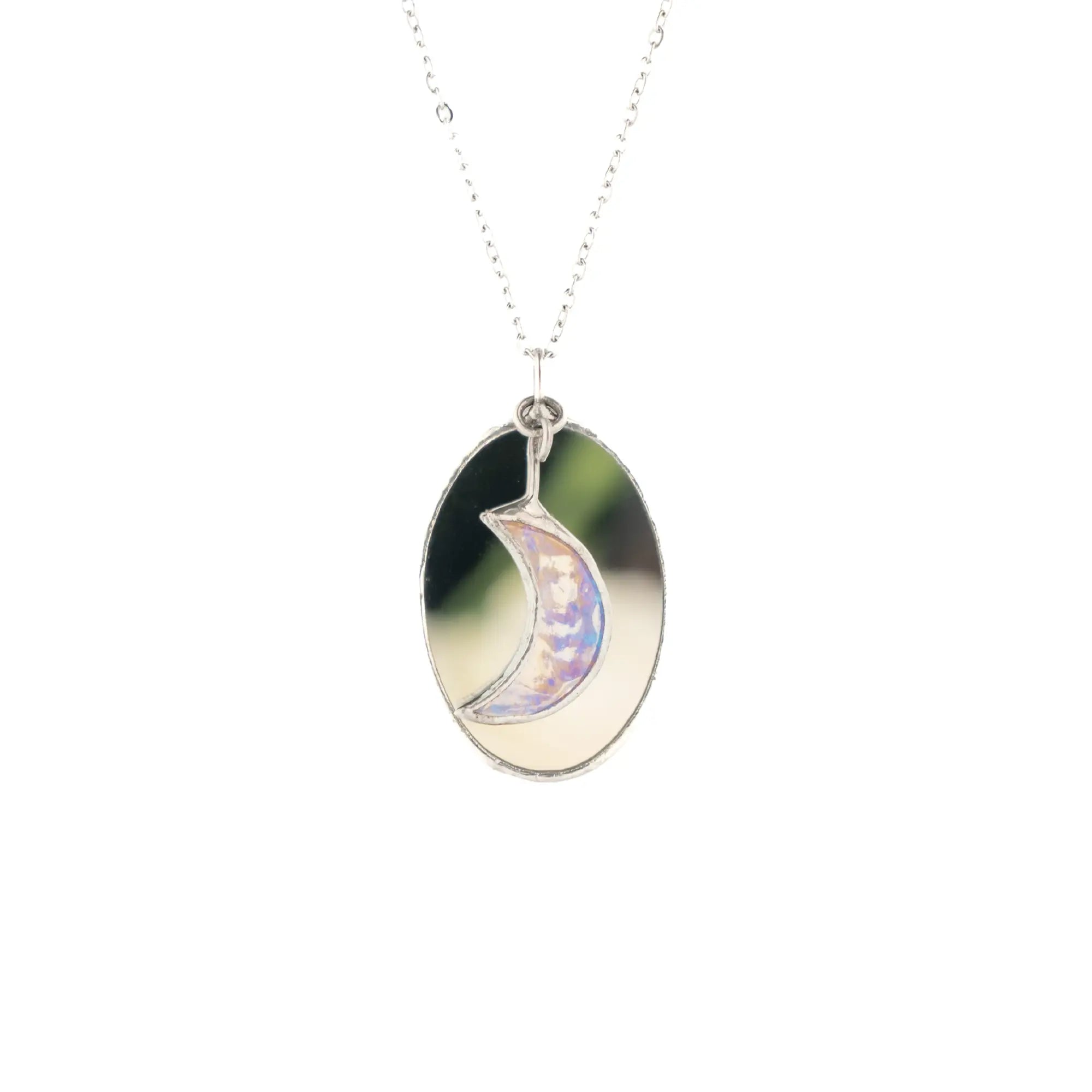 Handmade stained glass moon necklace with an iridescent crescent moon set over an oval mirror pendant on a stainless steel chain - a celestial gift for her from Glass Art Stories