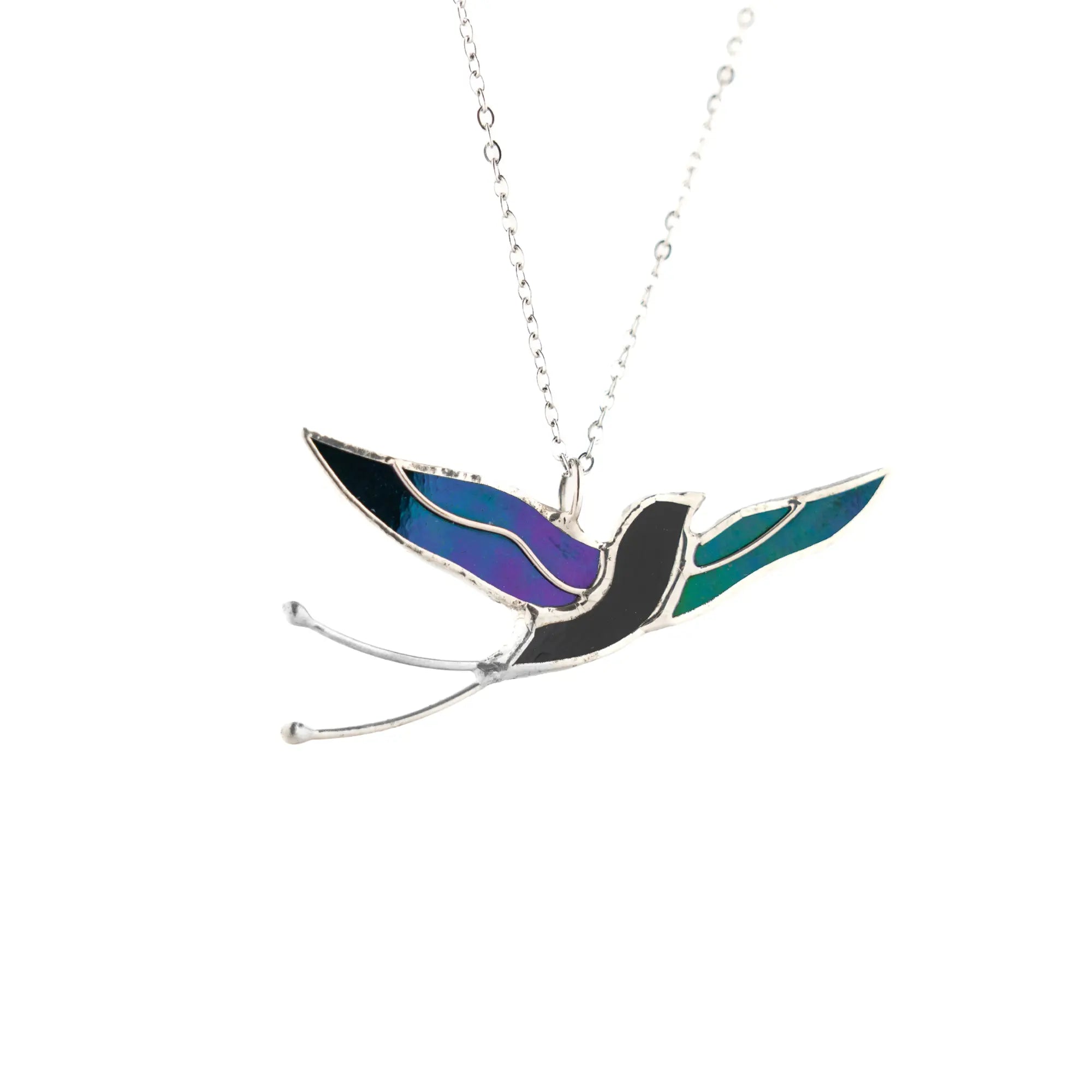 Handmade stained glass swallow necklace - a graceful bird in flight cut from shimmering iridescent glass, on a fine stainless steel chain, a bird lover gift from Glass Art Stories