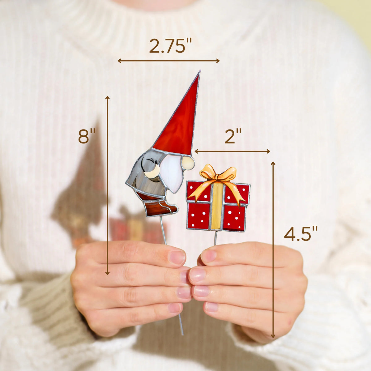 Hands holding the Christmas gnome and gift stained glass plant stakes - gnome 8 inches tall and 2.75 inches wide, gift 4.5 inches tall and 2 inches wide - handmade Christmas decor