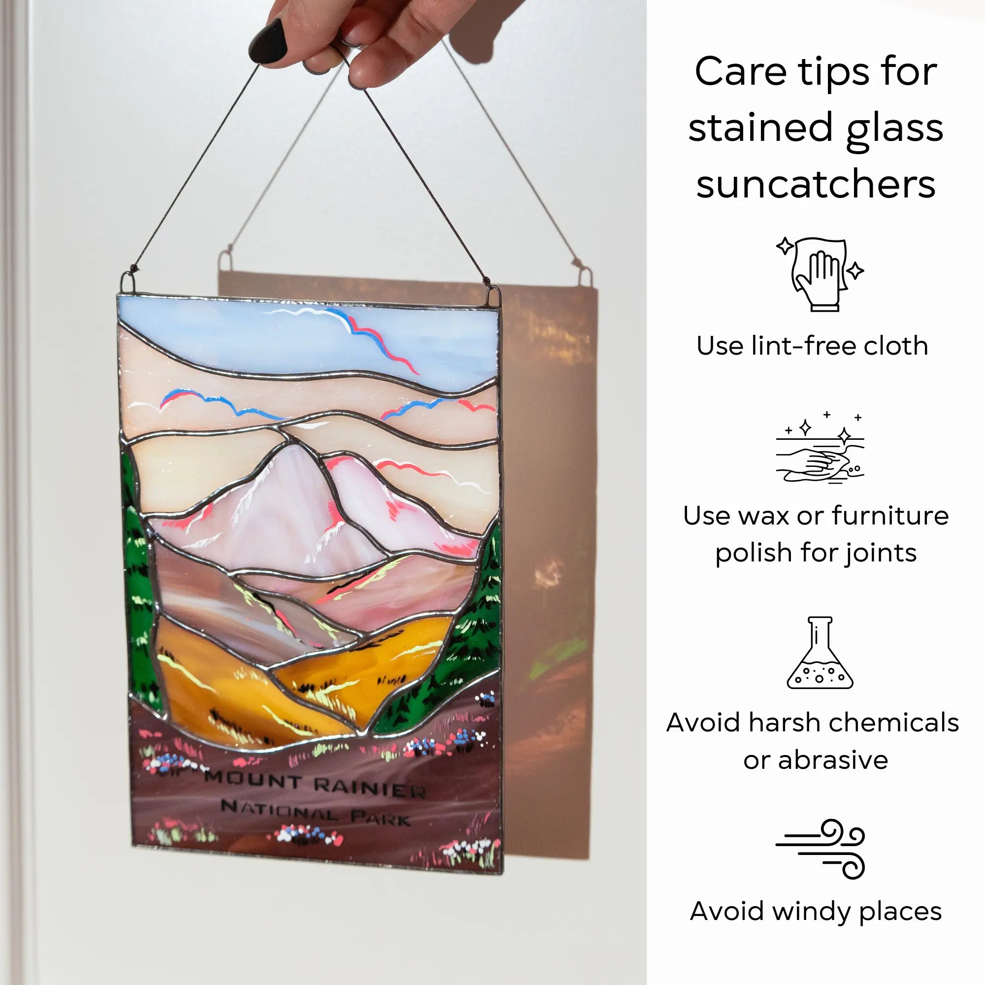 Stained glass suncatcher with care tips on a white background: use lint-free cloth, polish joints with car wax or furniture polish, avoid harsh chemicals, and windy places.