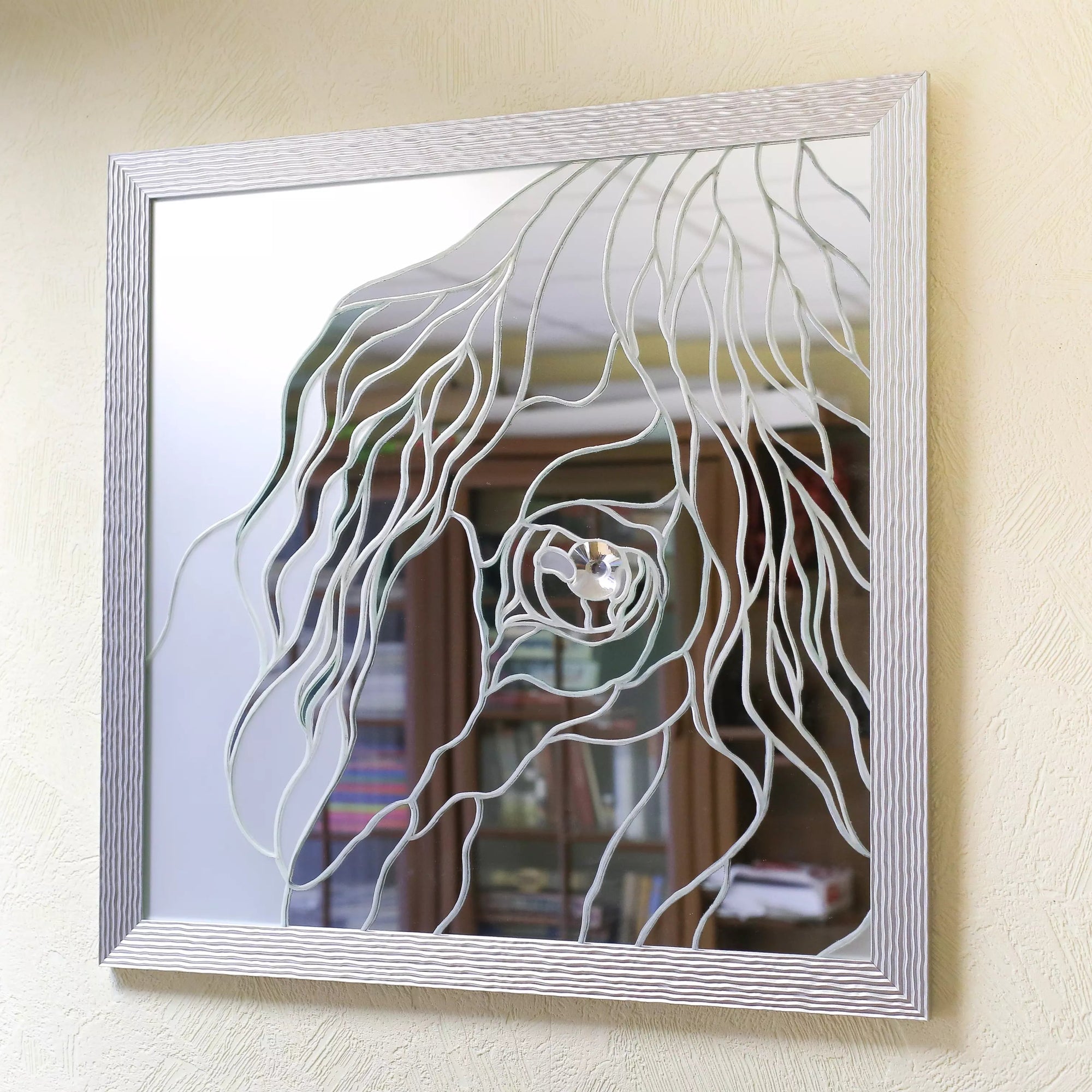 Elegant mirror featuring a stained glass horse eye design and wave-textured silver border