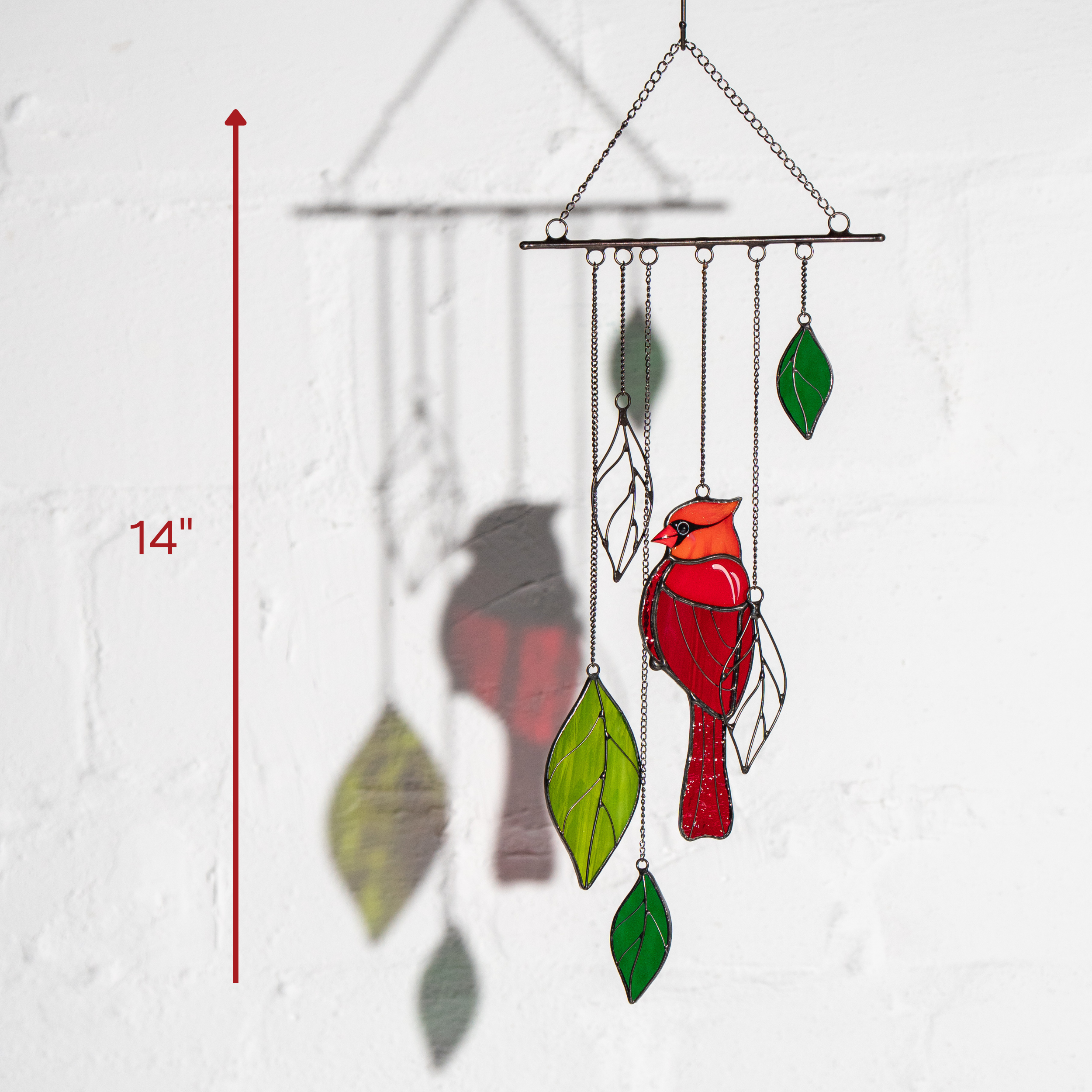 Stained glass wind chime with red cardinal and colorful leaves, measured at 14 inches in height.
