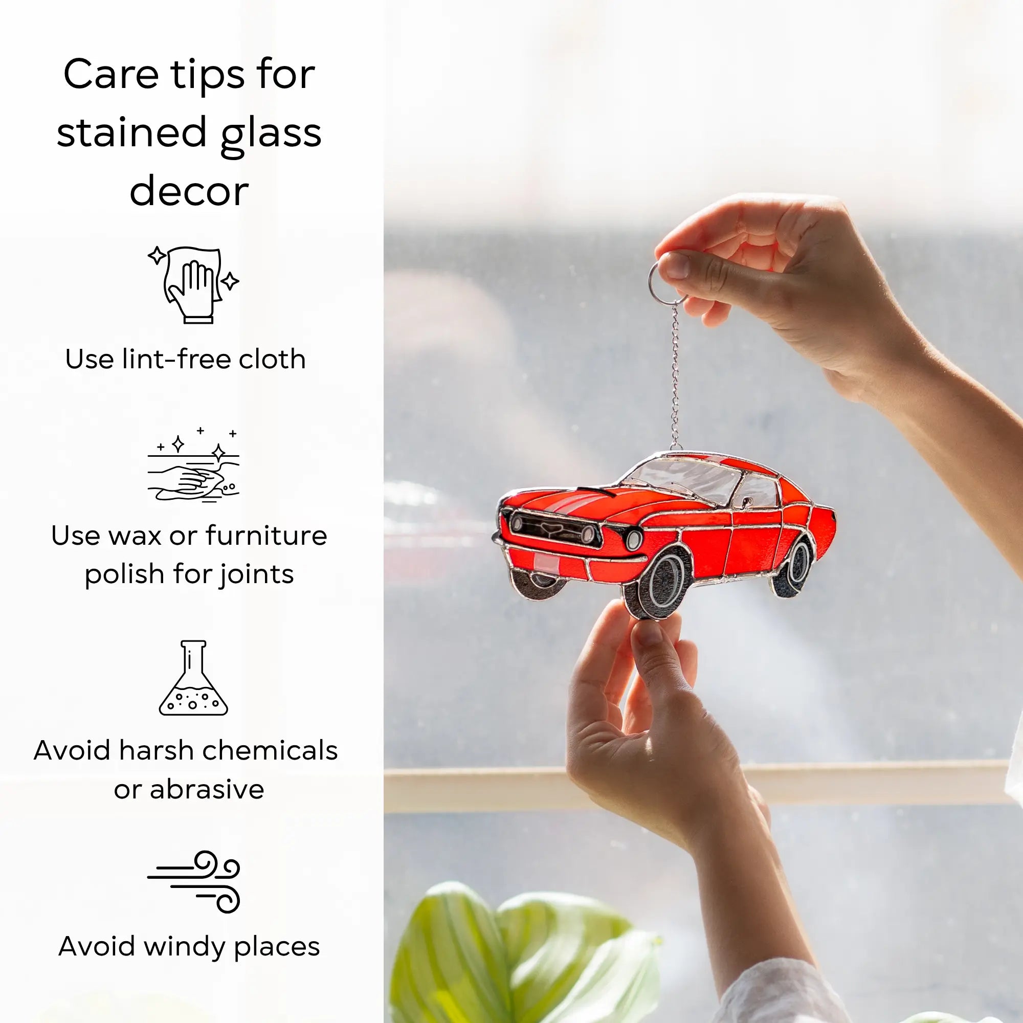 Care tips for stained glass suncatcher with a red car ornament held by a hand: use lint-free cloth, polish joints with car wax or furniture polish, avoid harsh chemicals, and windy places.