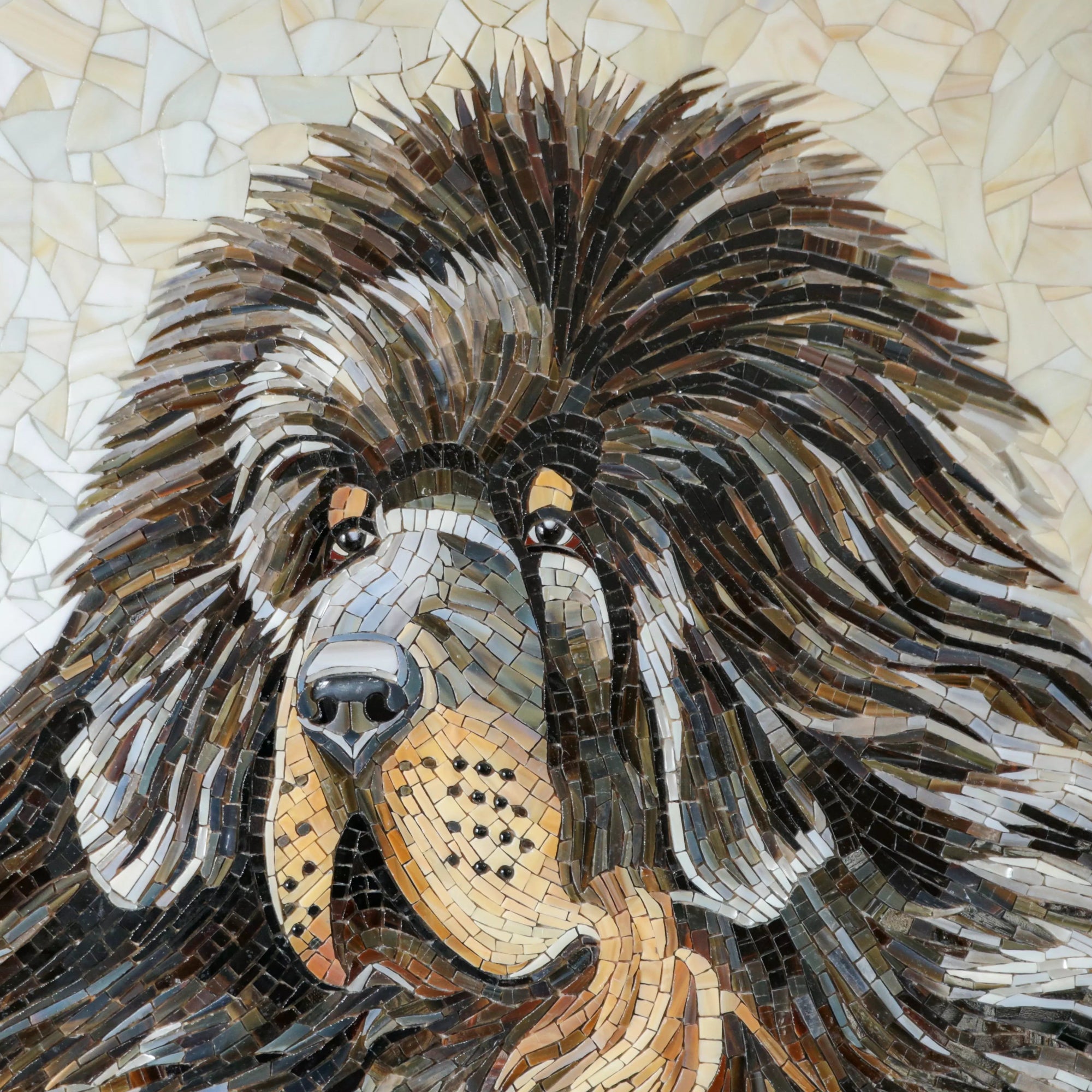 Detailed close-up of a mastiff mosaic showing layered glass in warm browns, ochres, and black for shading.