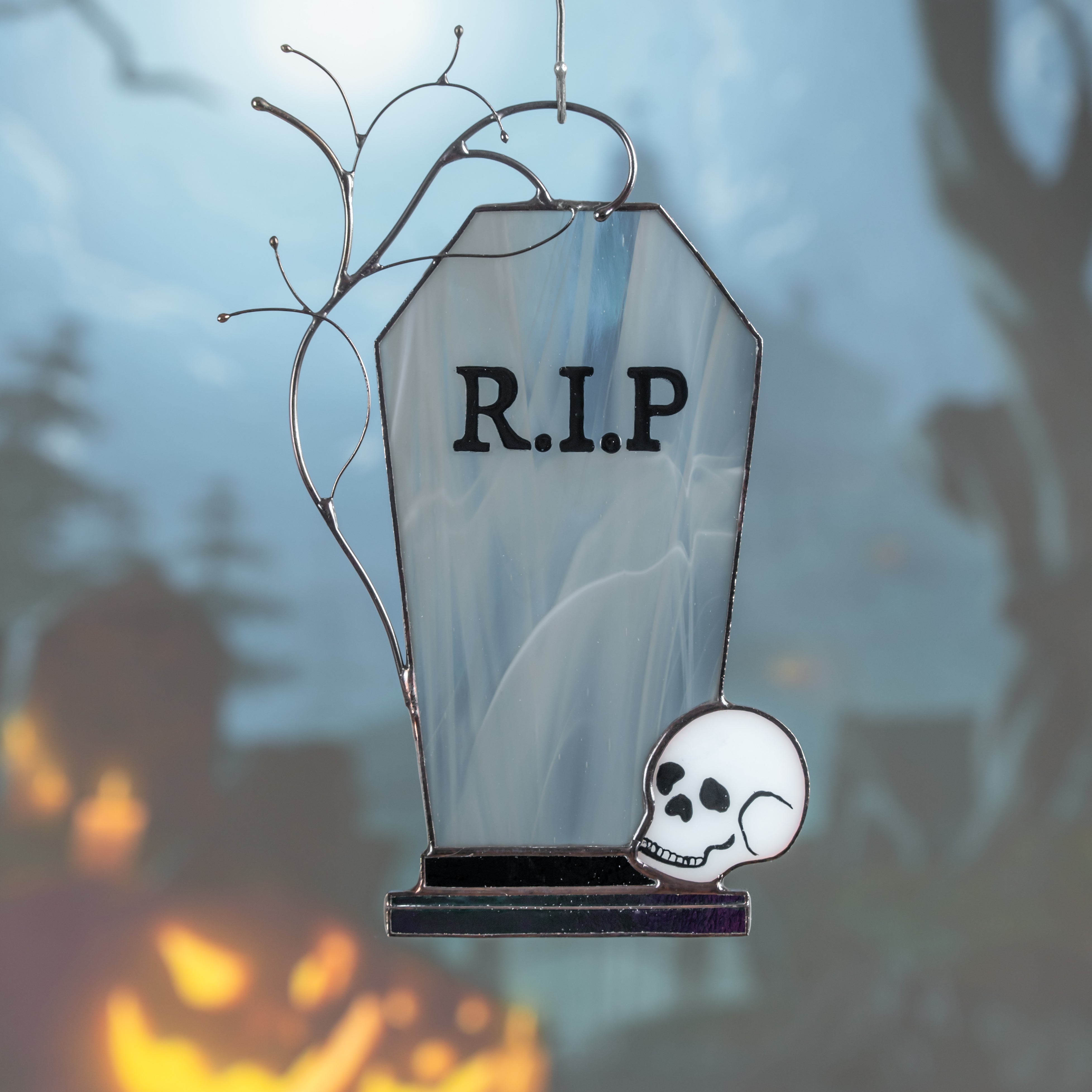 Tombstone suncatcher with misty forest in the background, adding eerie Halloween mood.
