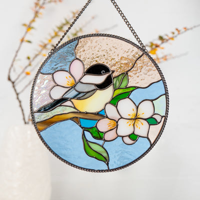 handcrafted glass chickadee art in round shape