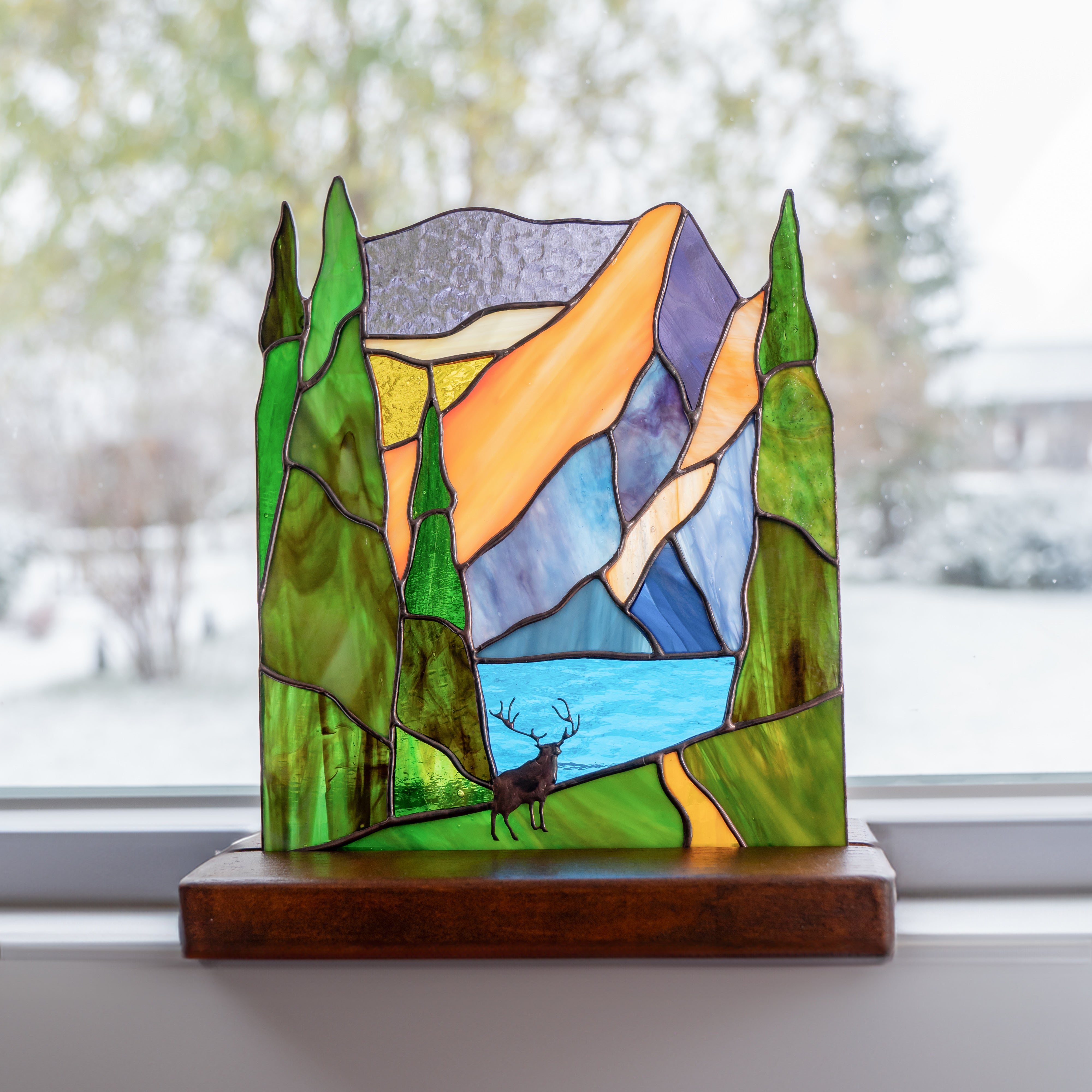 panel of deer in the forest made of stained glass