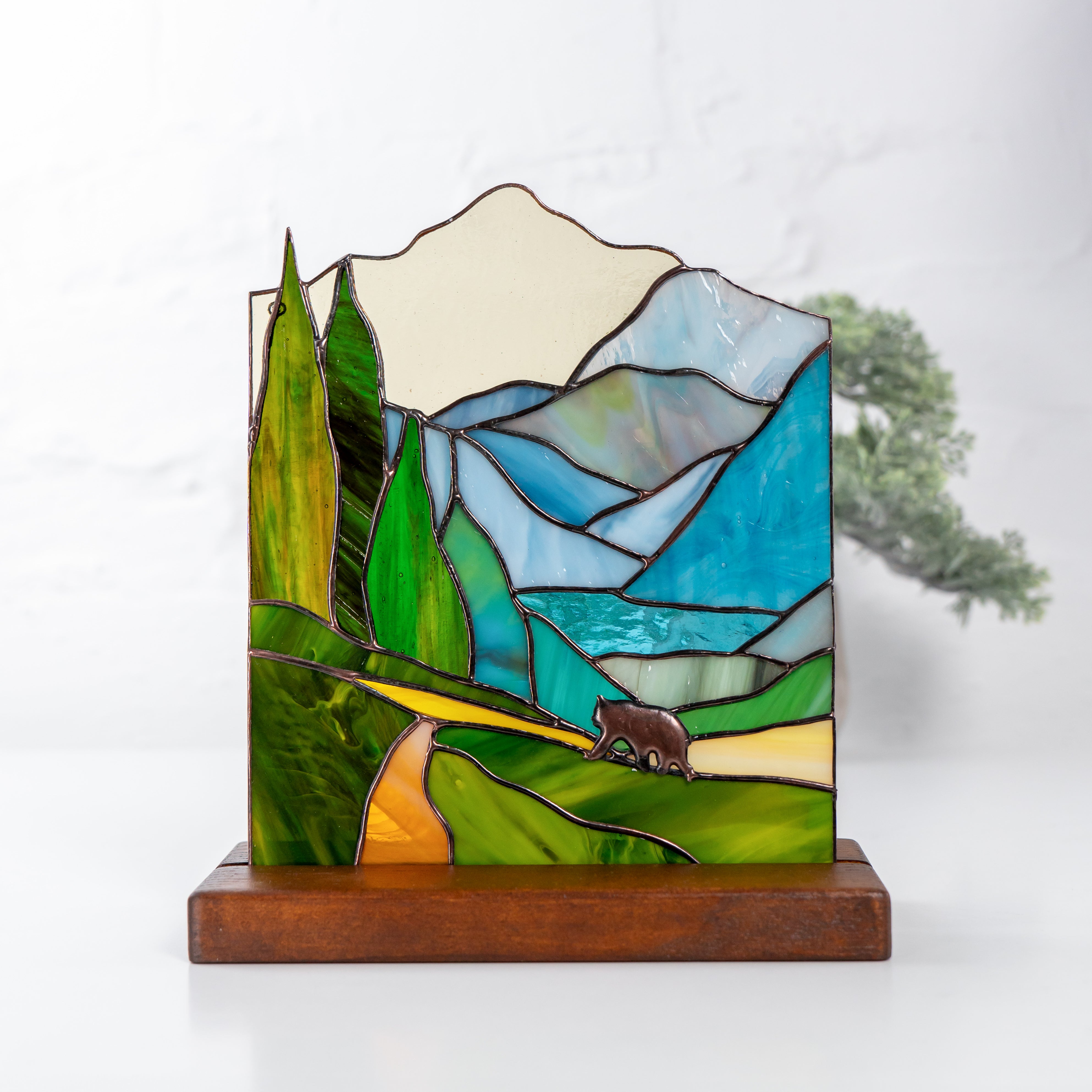 panel of bear in the forest made of stained glass