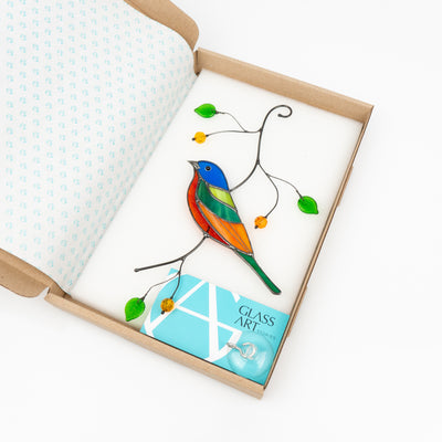 Painting bunting bird suncatcher of stained glass in a brand box