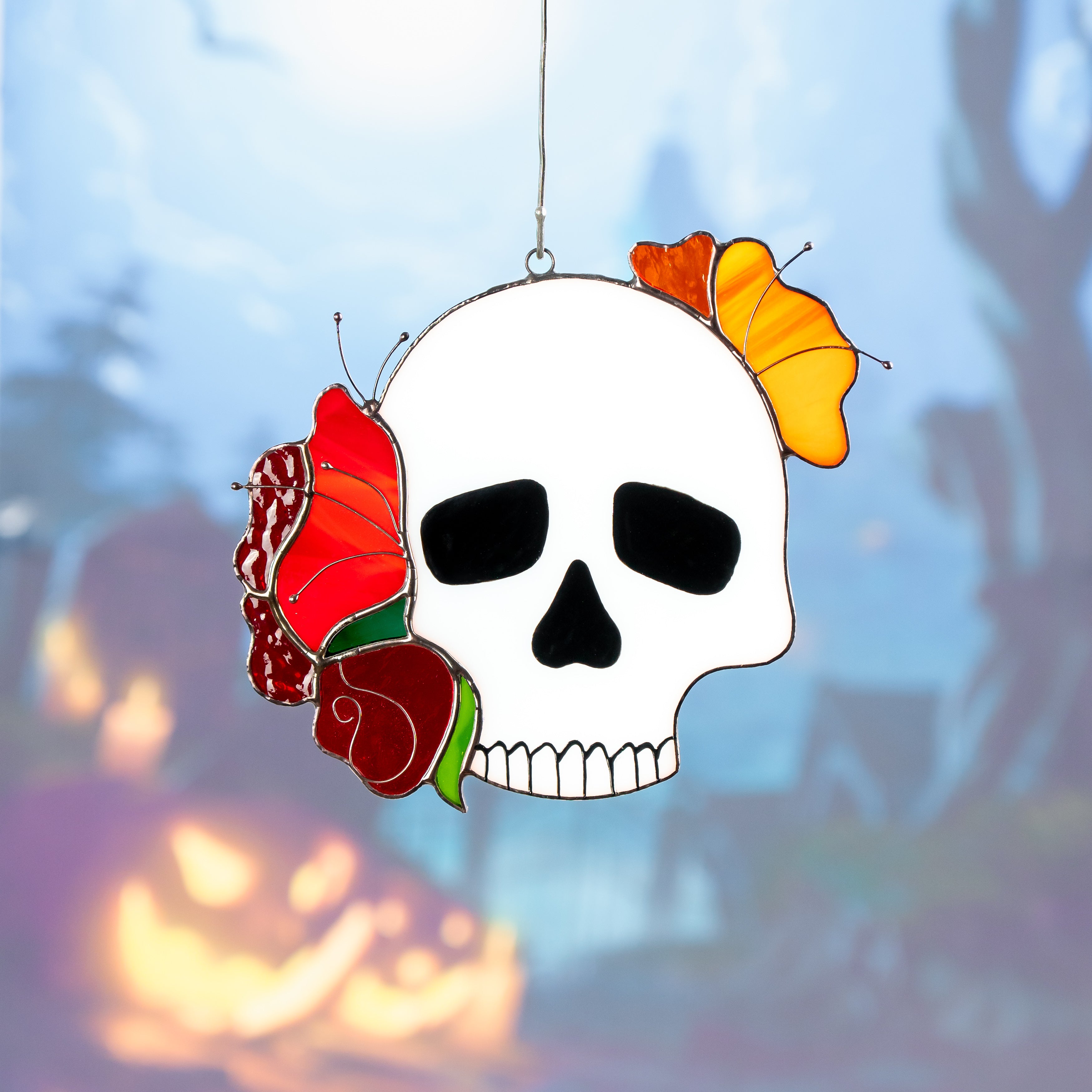 Human skull stained glass window hanging