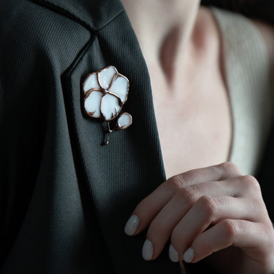 Stained glass cotton pin on a black jacket
