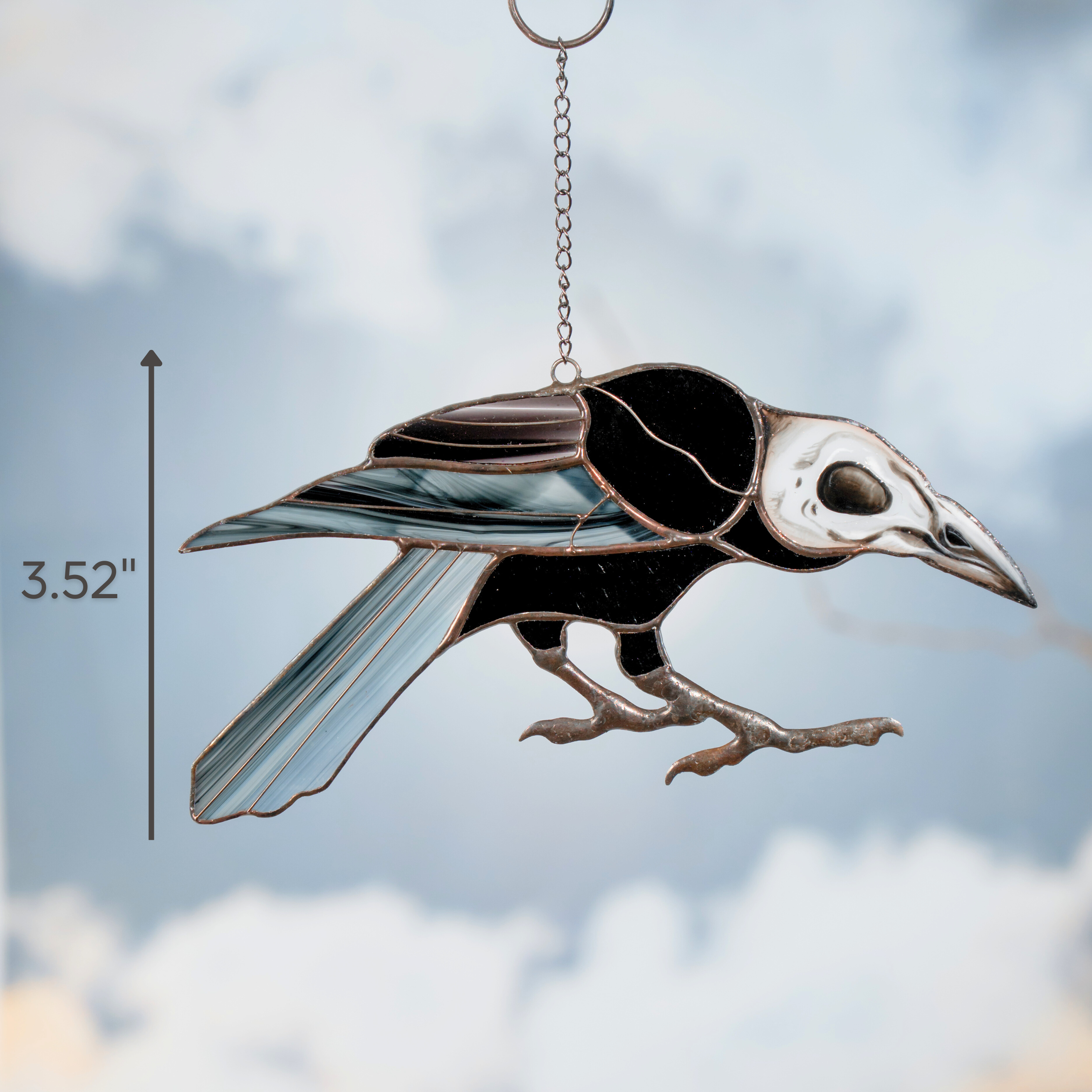 Stained glass raven hanging on a cloudy background with vertical dimension line showing 3.52 inches tall.