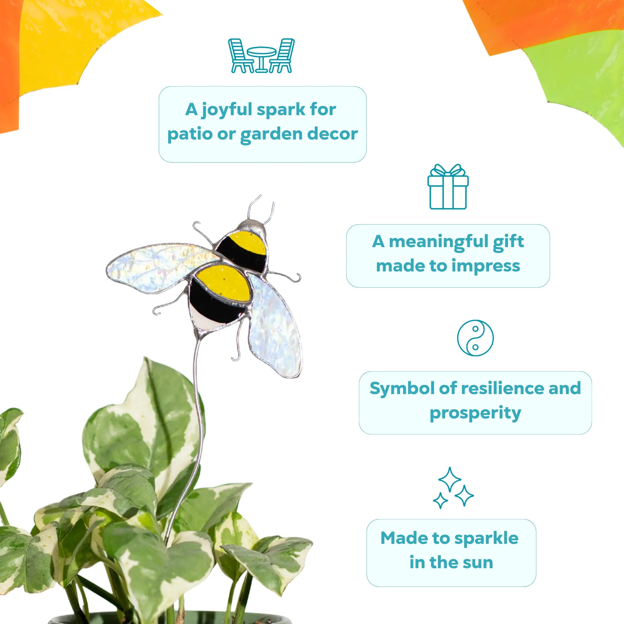 Decorative bee stained glass plant stake on a plant as a symbol of prosperity