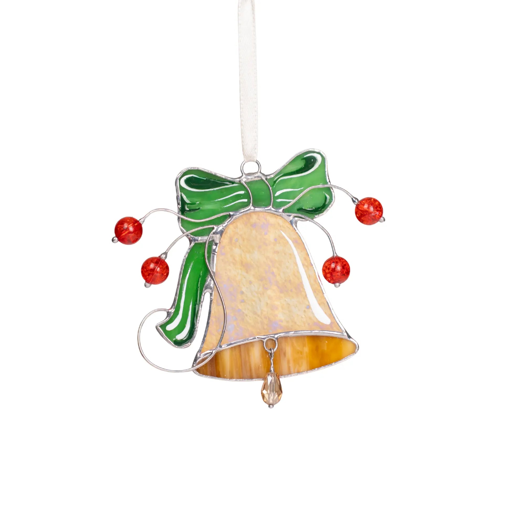 Stained glass bell ornament with green bow and red beads on a white background