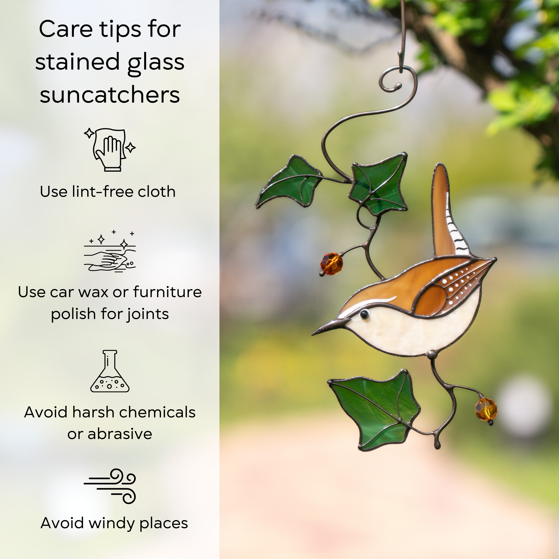 Carolina wren suncatcher hanging outdoors among greenery, with cleaning and care tips: use lint-free cloth, use wax polish for joints, no harsh cleaners, avoid wind.