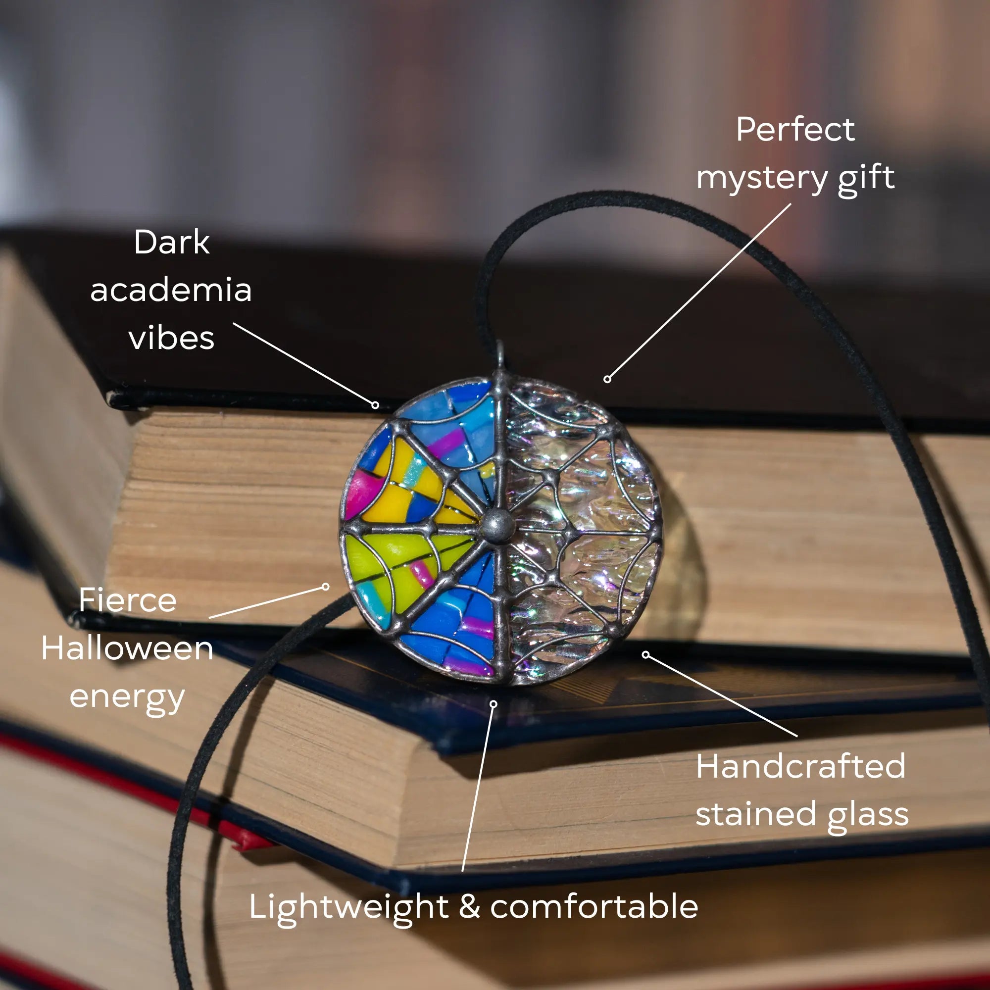 Decorative stained glass pendant on a book as a perfect mystery gift