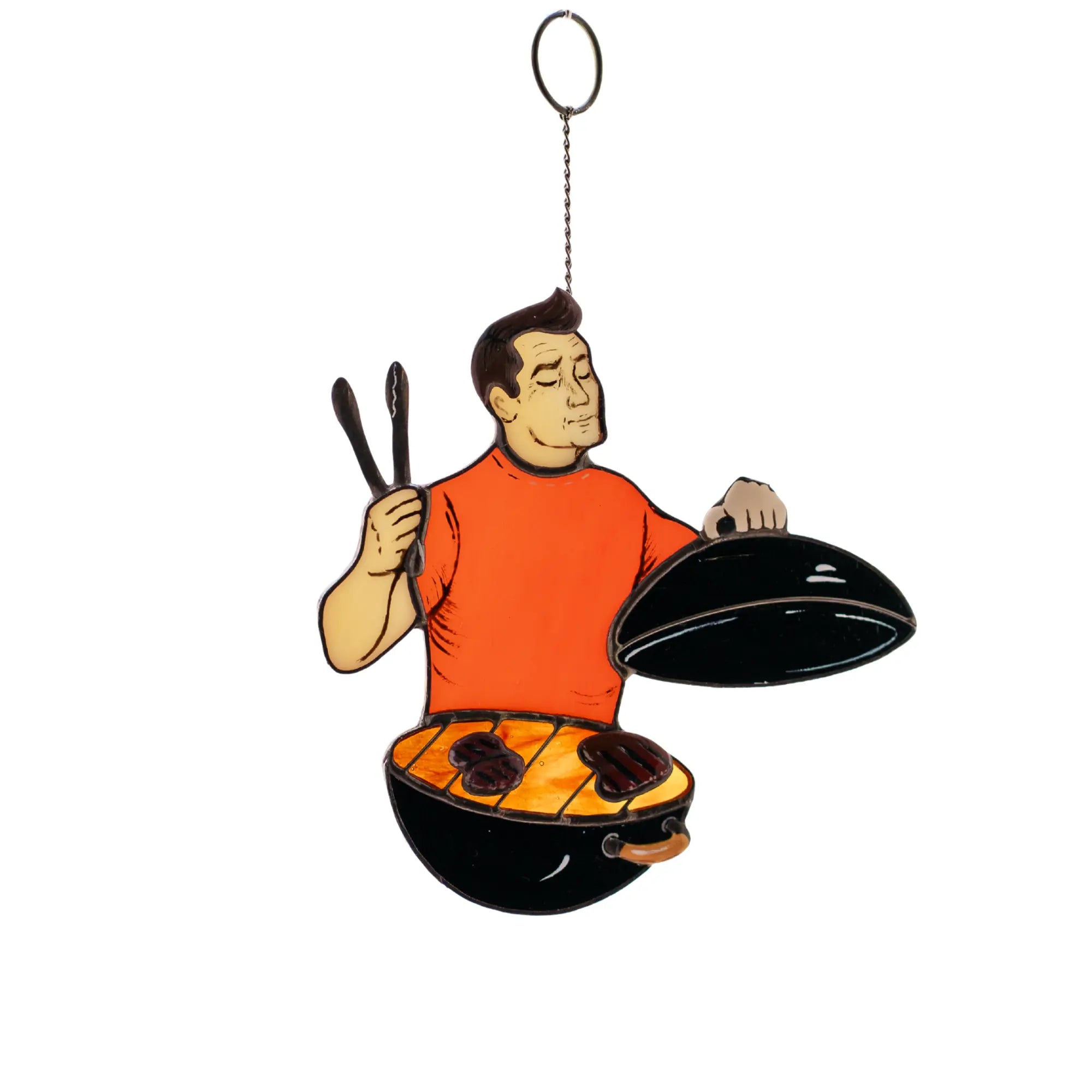 Decorative stained glass suncatcher of a cartoon man cooking on a grill with a white background