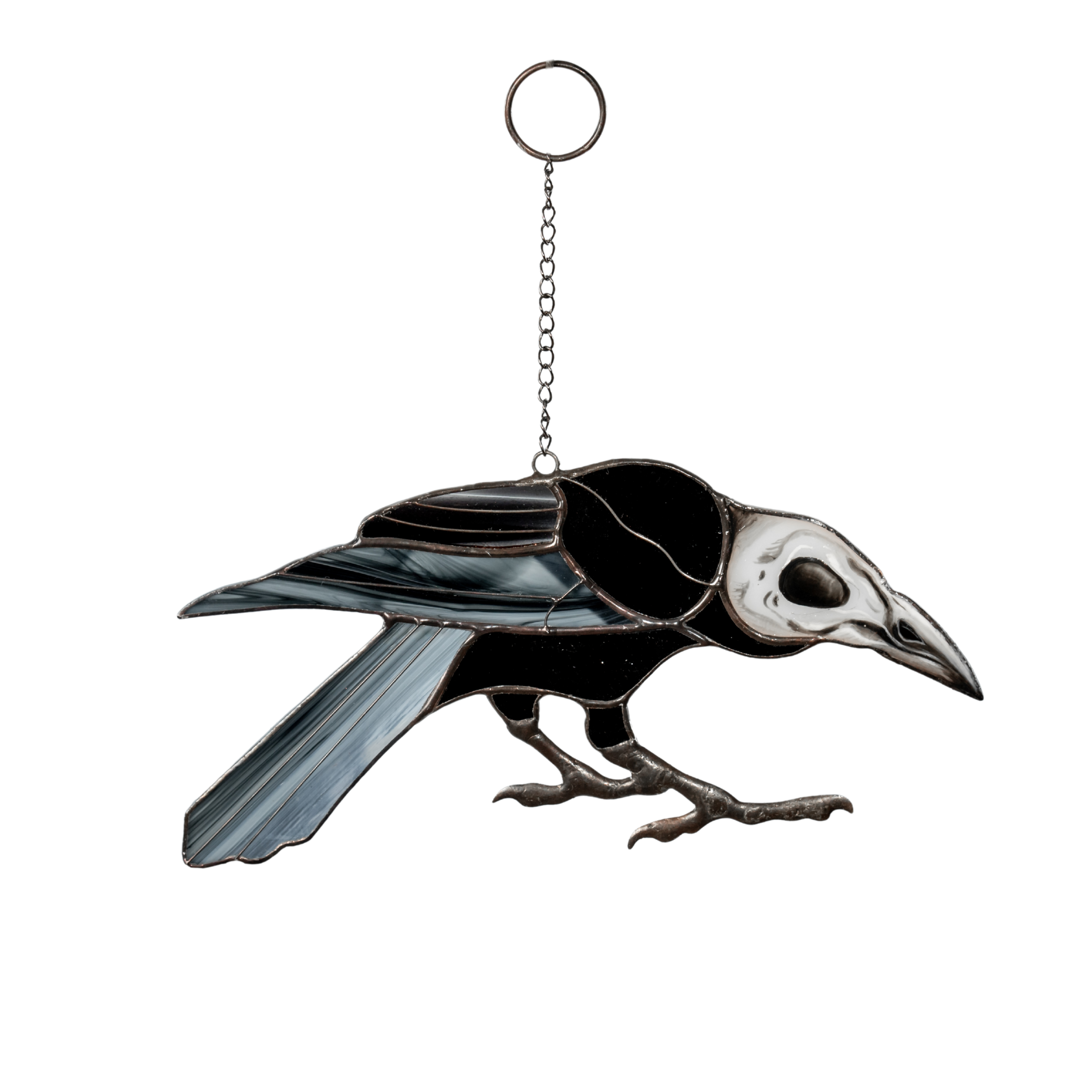 Stained glass raven with white skull head, black wings, on a hanging chain.