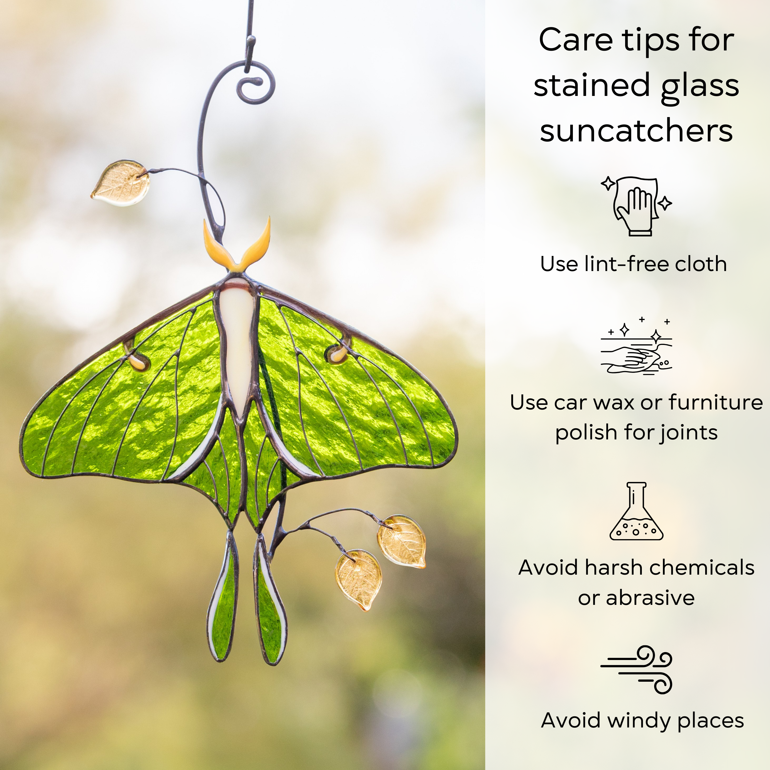 Stained glass luna moth hanging near a window, care instructions for glass decor shown beside: use lint-free cloth, use wax polish for joints, no harsh cleaners, avoid wind.
