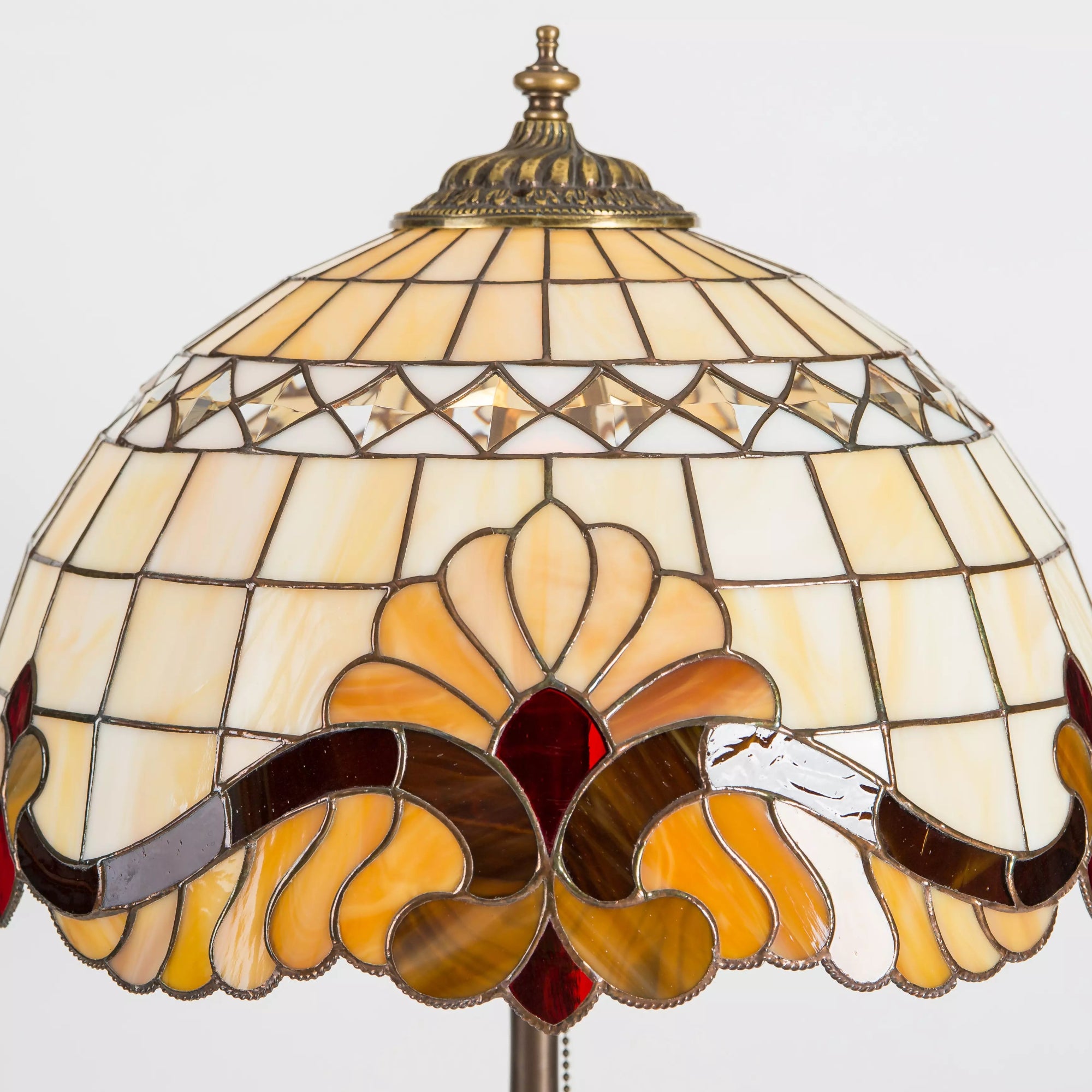 Tiffany-style lampshade with symmetrical amber flower and ruby red center