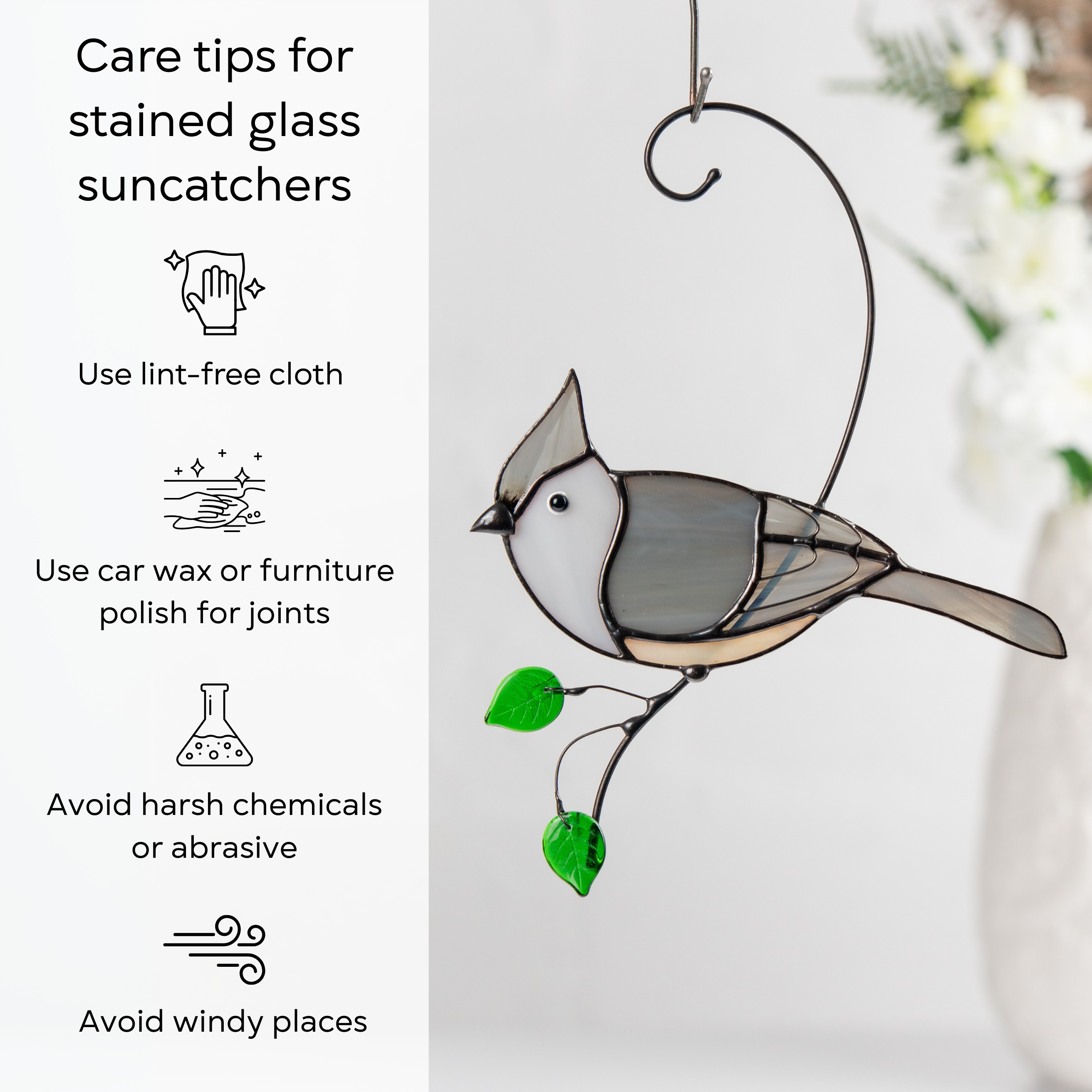 Gray and white stained glass tufted titmouse with green leaf beads and care instructions aside: use lint-free cloth, use wax polish for joints, no harsh cleaners, avoid wind.