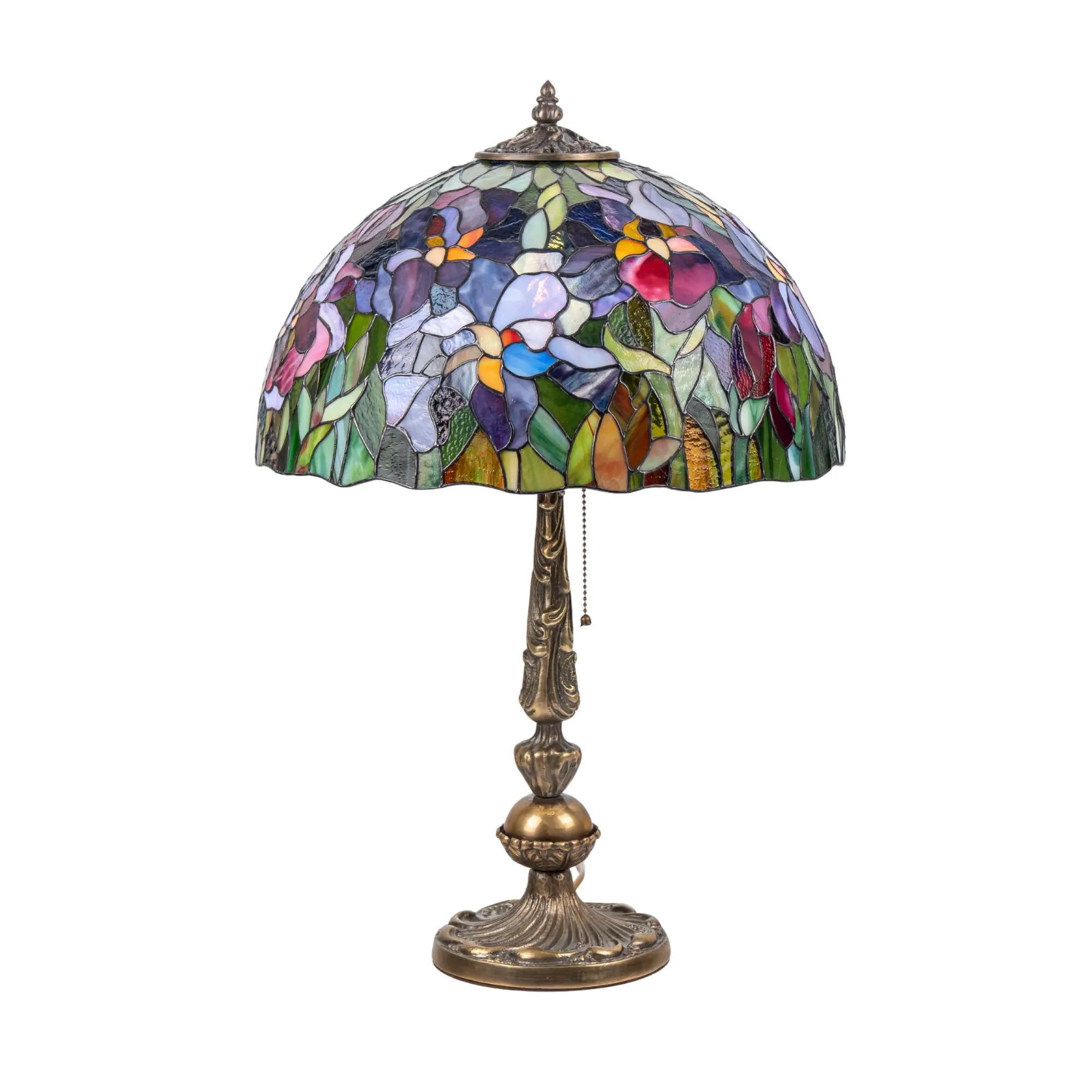Studio shot of stained glass lamp with blooming iris pattern on white background