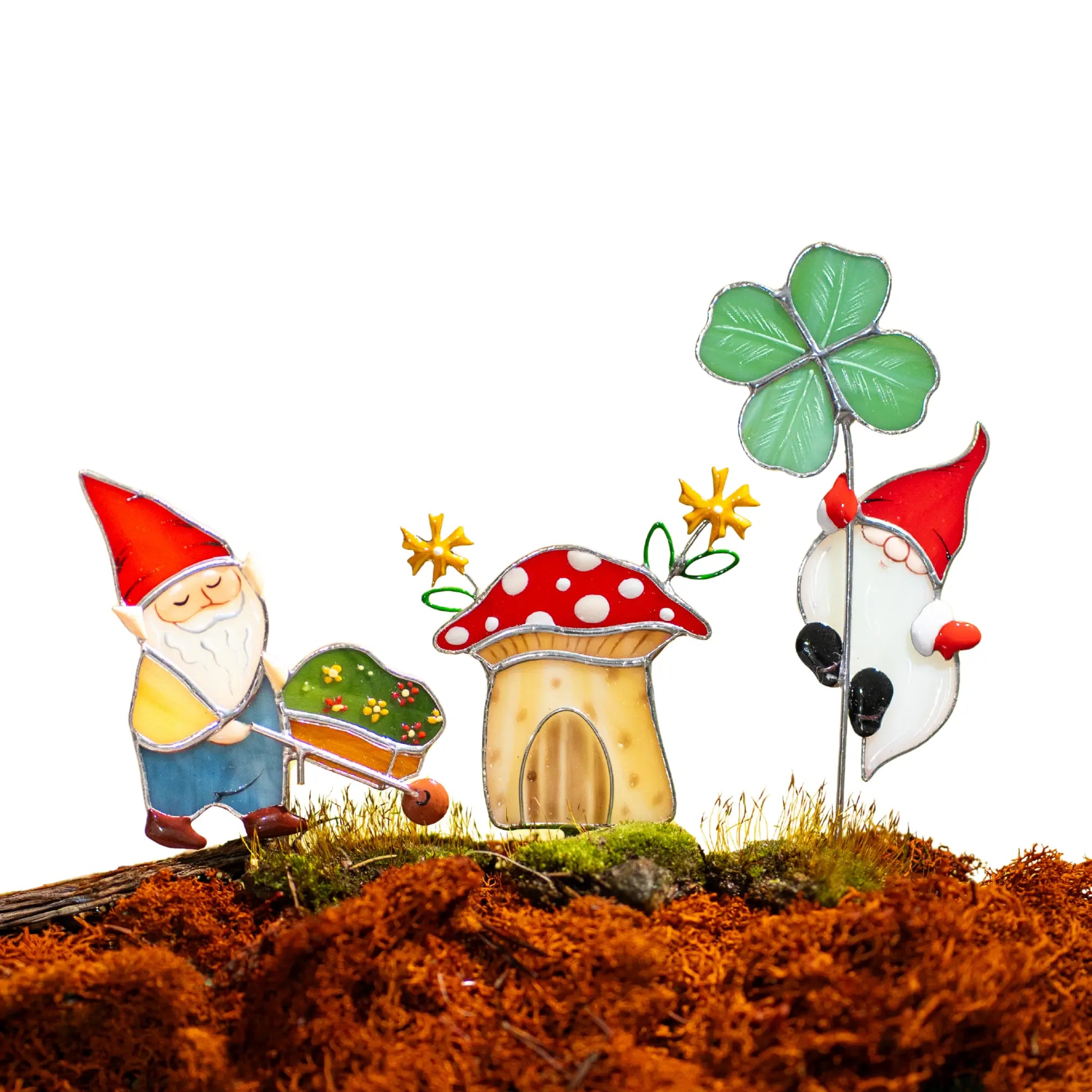 Gnome stained glass plant stakes with a mushroom house and flowers on a white background