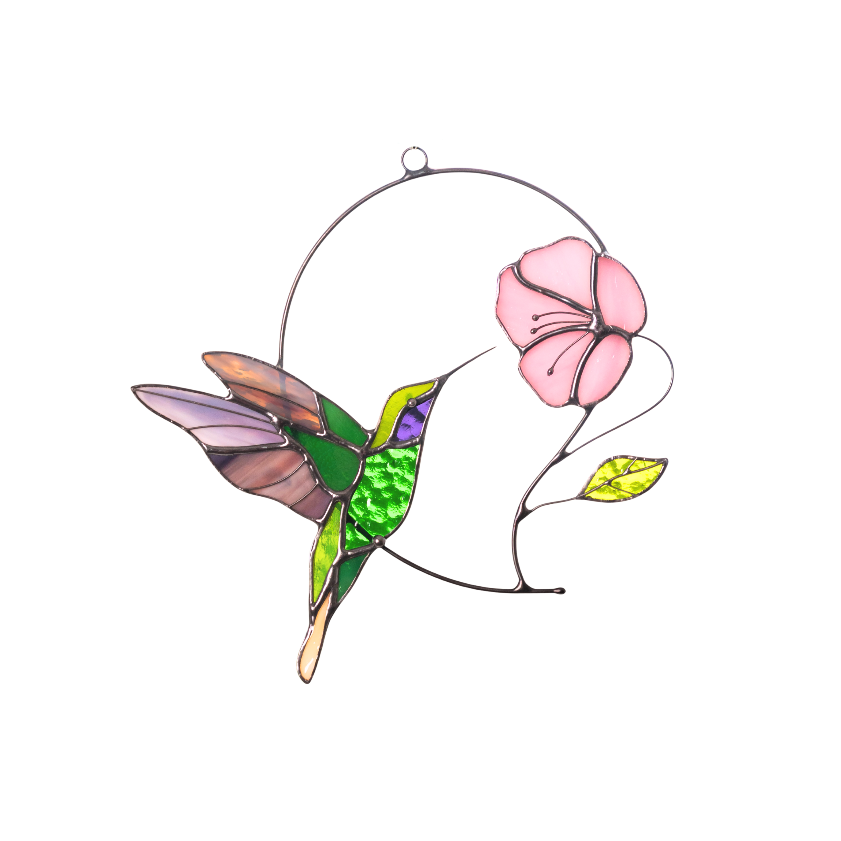 Green stained glass hummingbird with soft pink wings and flower, casting shadow on white surface