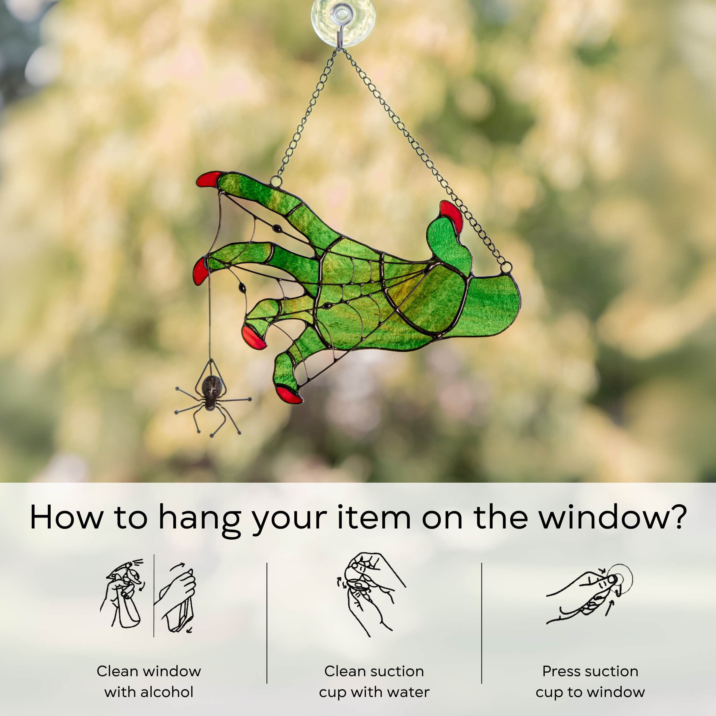 Instruction image showing how to hang stained glass witch hand with a spider on a window using a suction cup: clean window and suction cup, press a cup to the surface