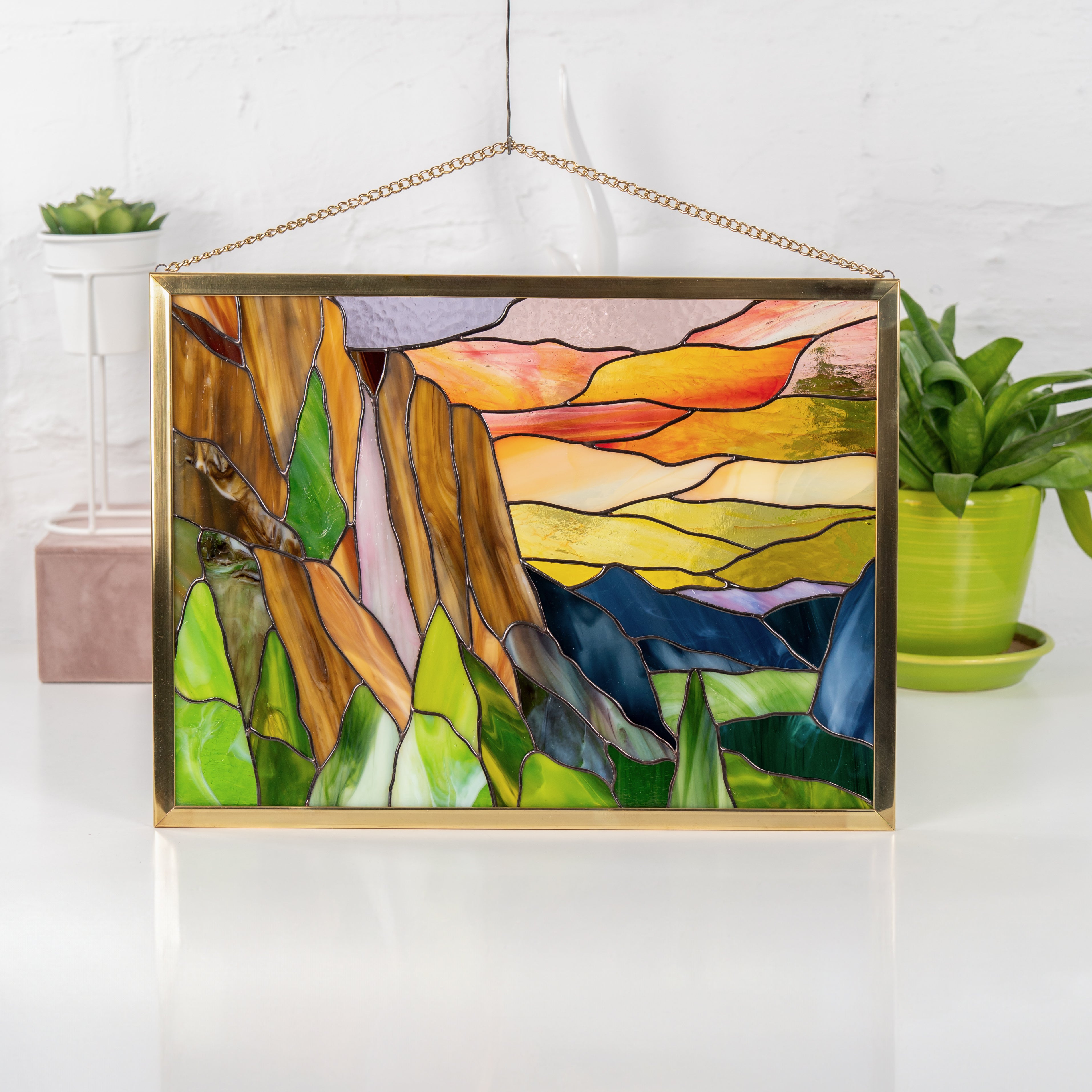 Front view of Yosemite panel in stained glass with sunset tones, geometric mountain shapes, and nature-inspired palette.