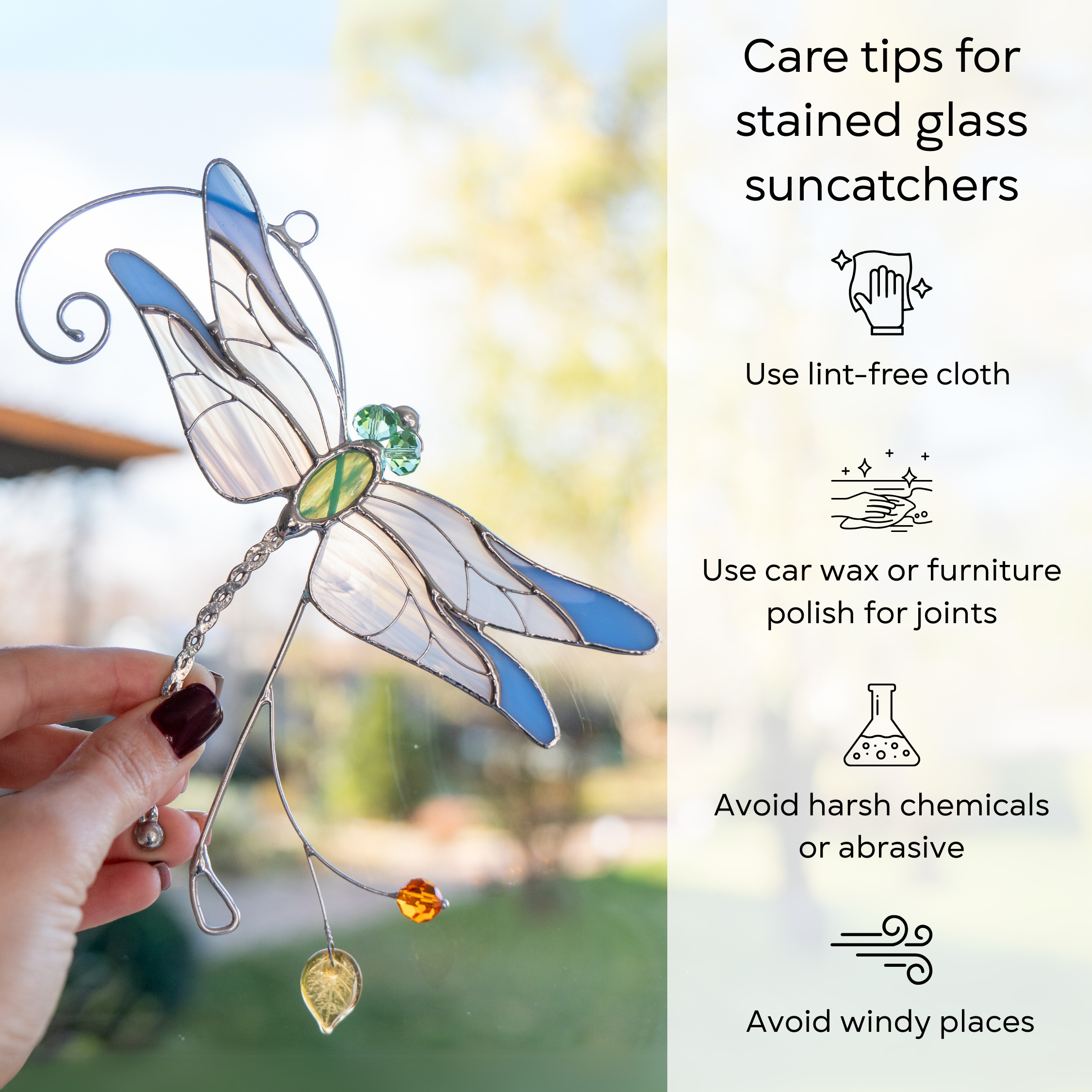A person holding a stained glass dragonfly while care instructions for cleaning and preserving it are shown: use lint-free cloth, use wax polish for joints, no harsh cleaners, avoid wind.