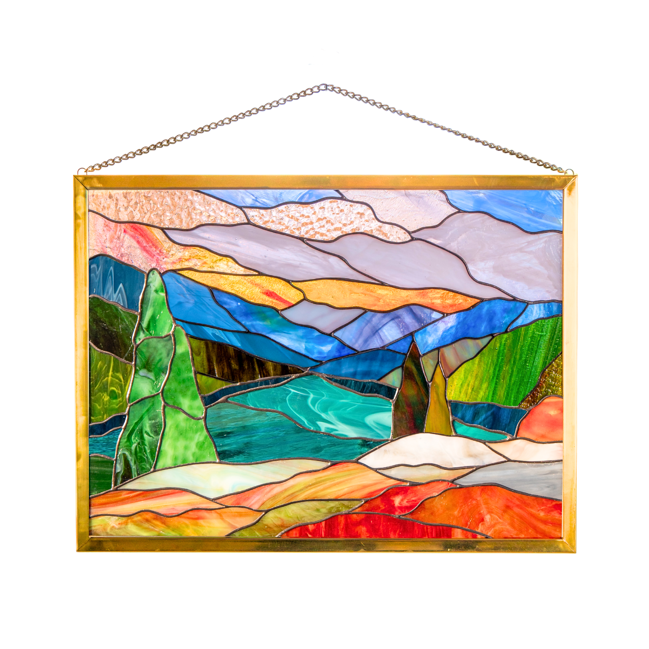 Stained glass panel showing Mount Rainier with lake, trees, and vibrant pink sunrise sky in gold frame