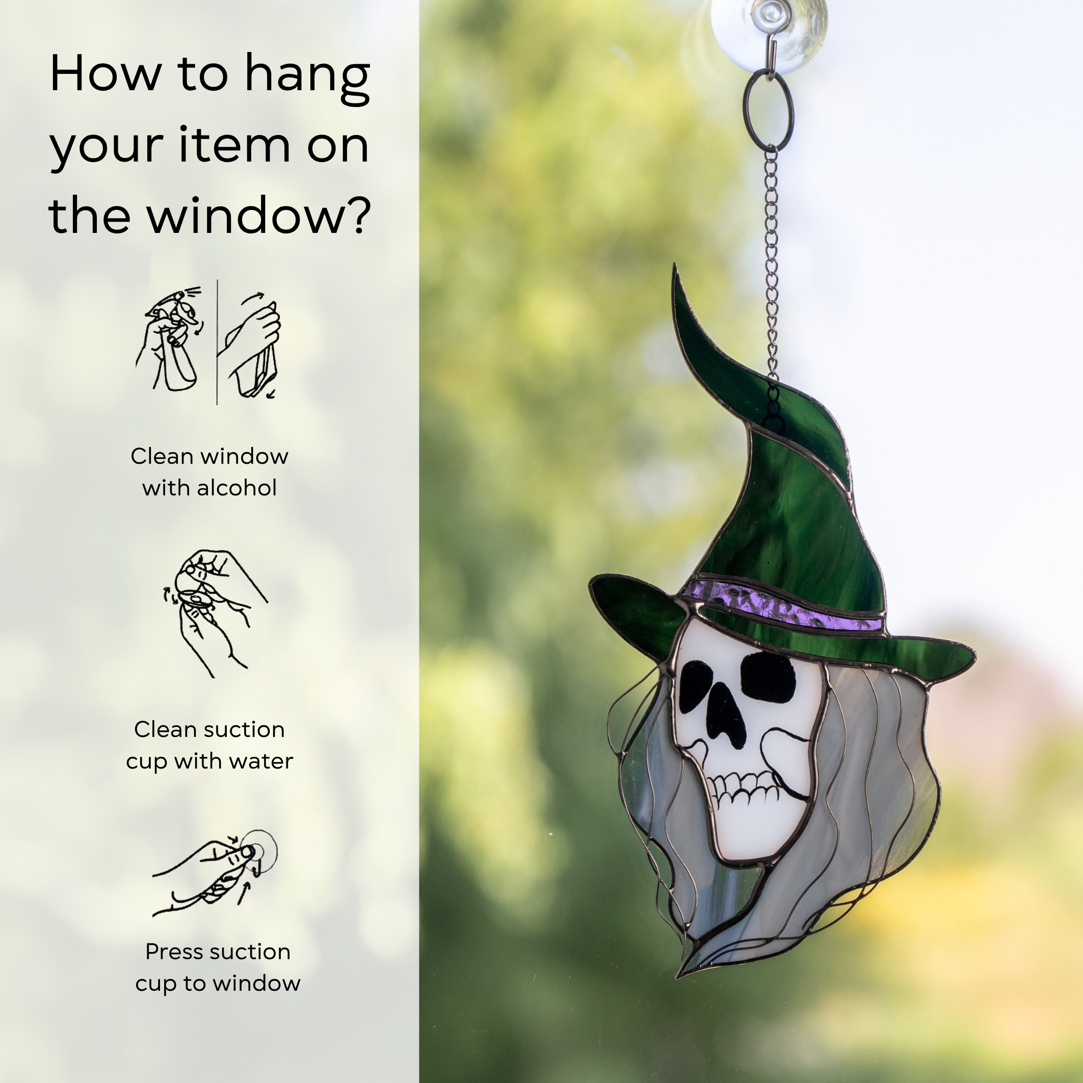 Skull-faced witch with flowing hair and a tall green hat hanging on a window with suction cup and instruction beside: clean window and suction cup, press a cup to the surface
