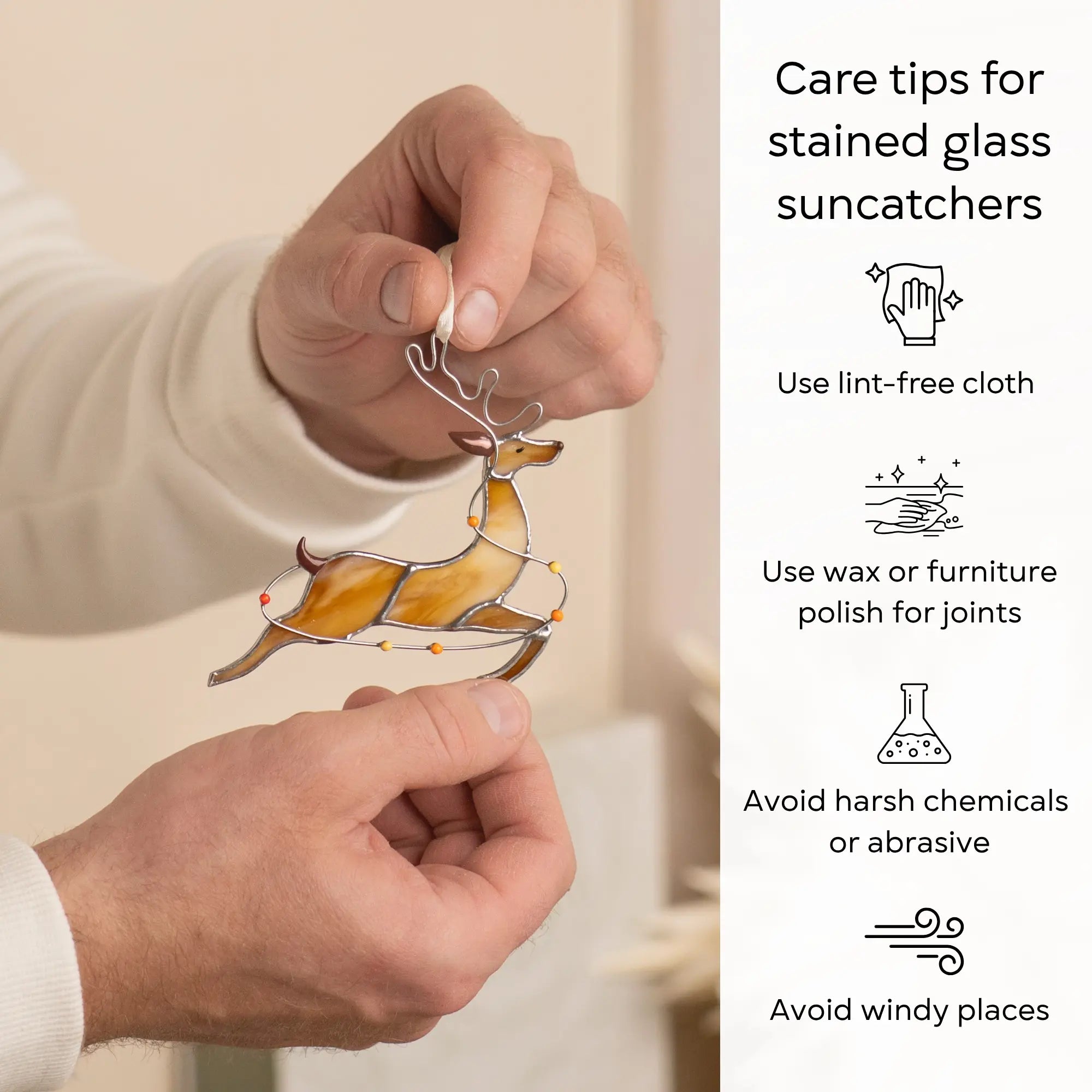 Stained glass reindeer with colored lights, glimmering in Christmas colors, hanging from a ribbon with care tips beside: use lint-free cloth, polish joints with car wax or furniture polish, avoid harsh chemicals, and windy places.