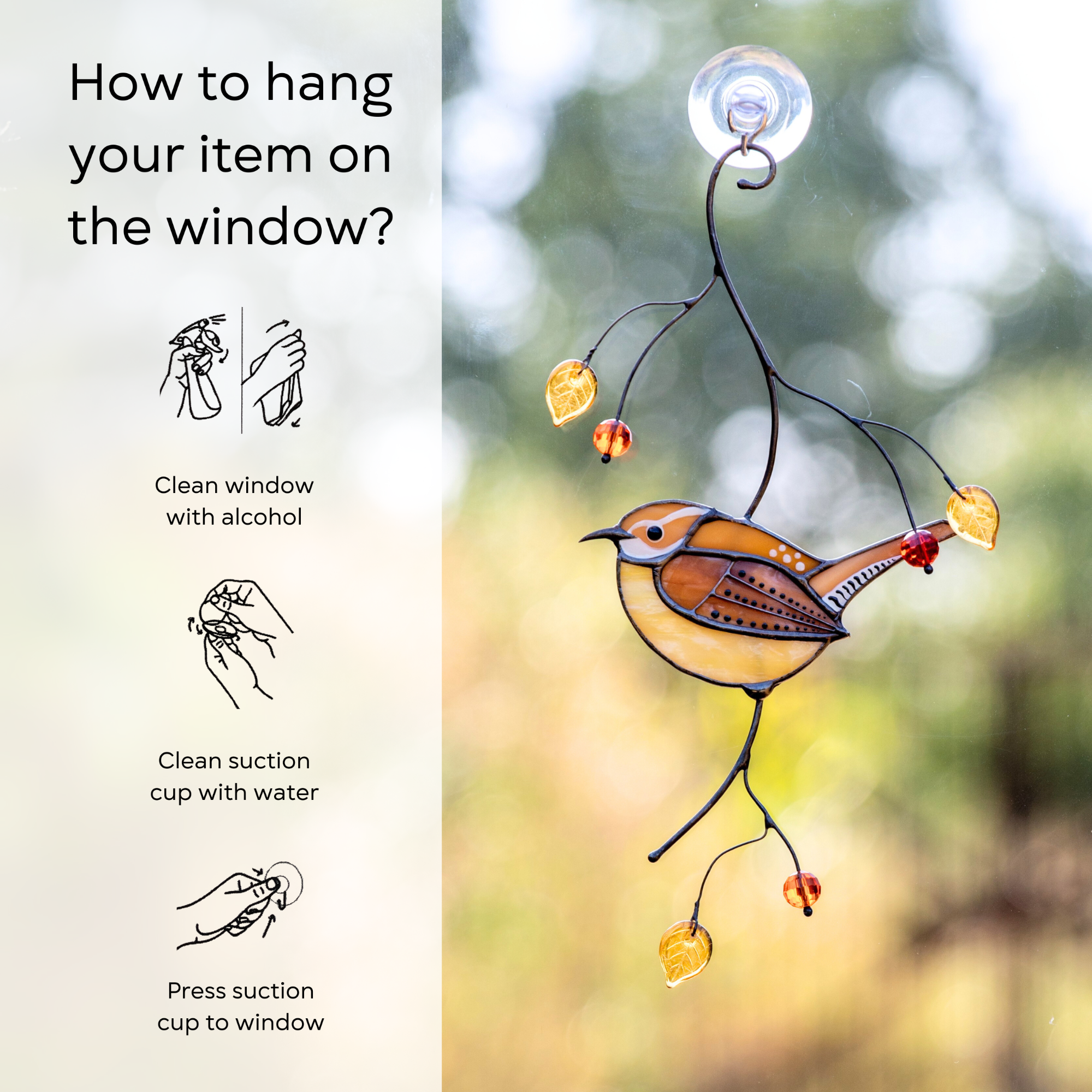 Carolina wren suncatcher hanging on a window via suction cup, shown with illustrated hanging instructions: clean window and suction cup, press suction cup to the surface