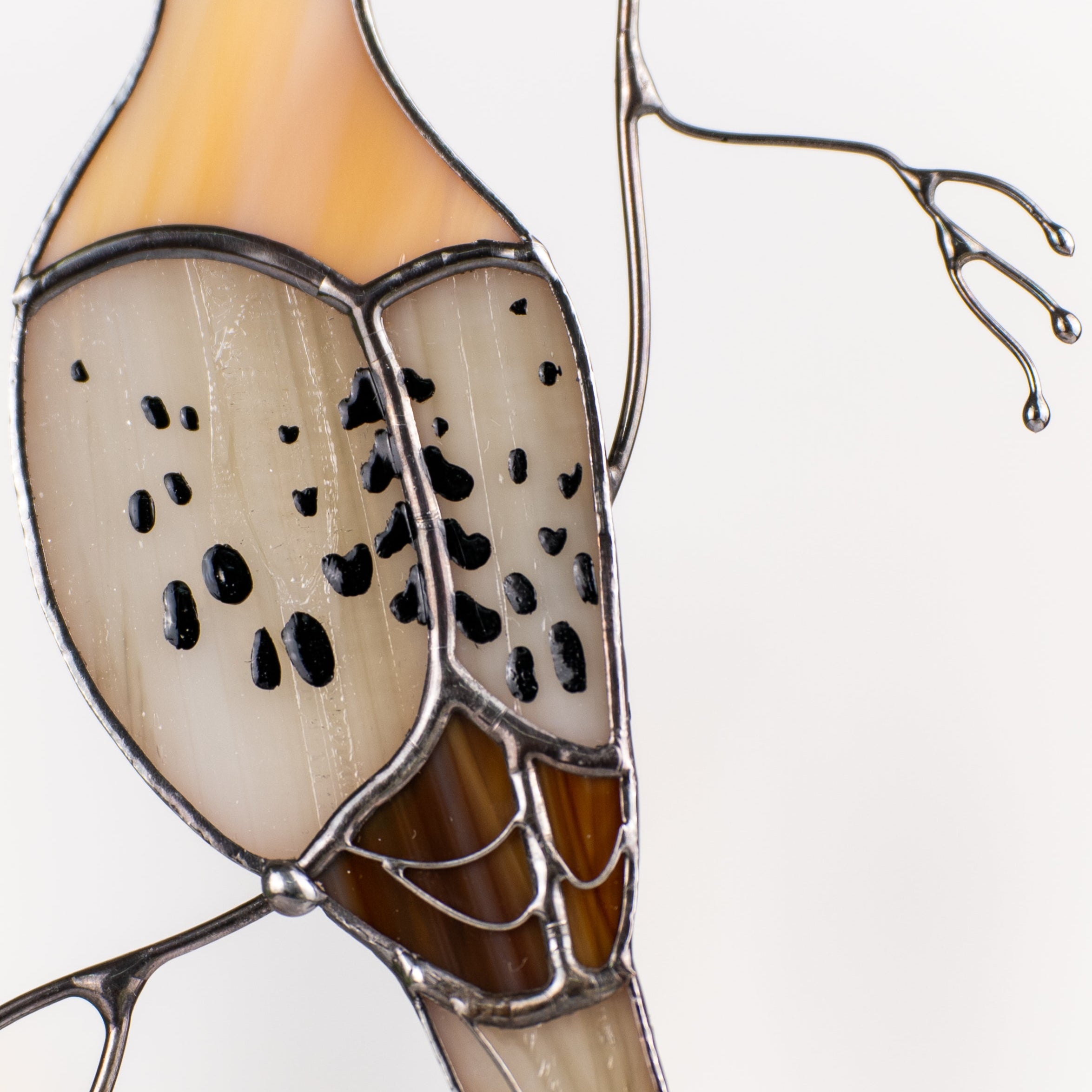Close-up of soft-lit dove suncatcher