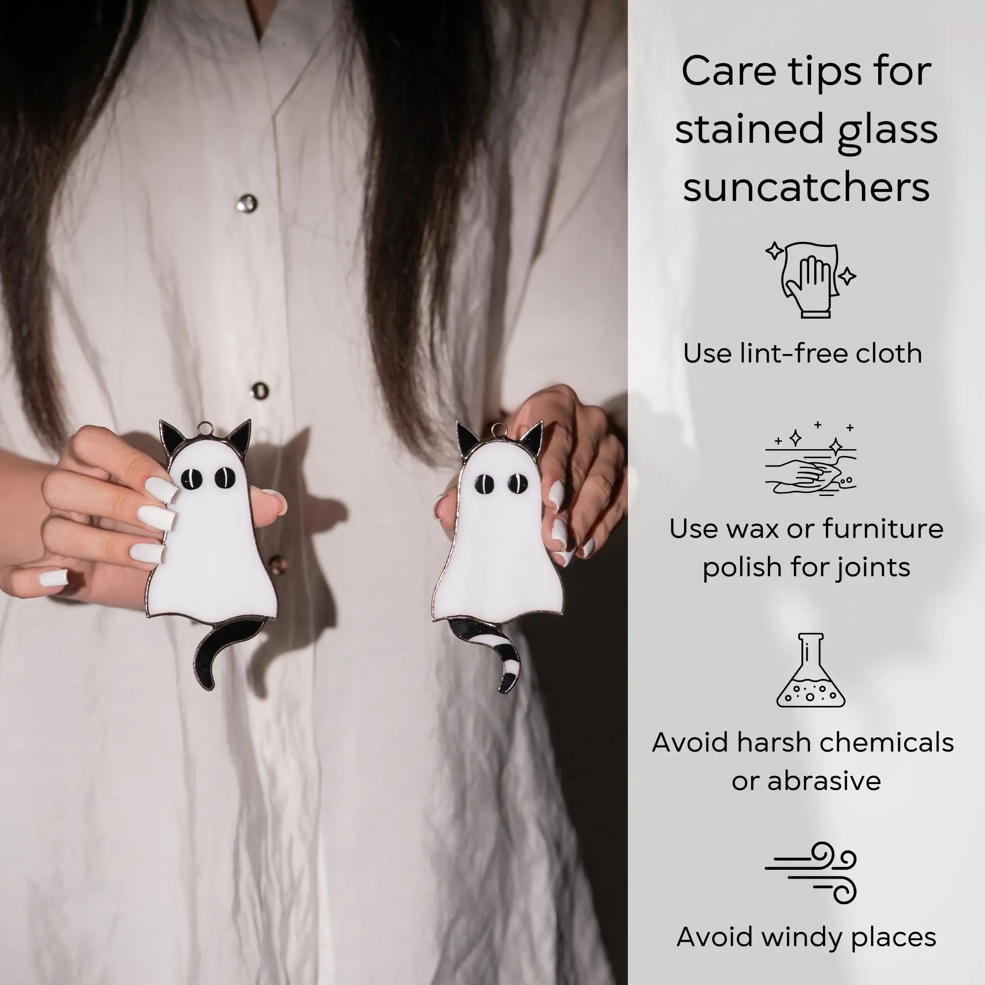 Person holding two ghost-shaped stained glass suncatchers with care tips: use lint-free cloth, polish joints with car wax or furniture polish, avoid harsh chemicals, and windy places.