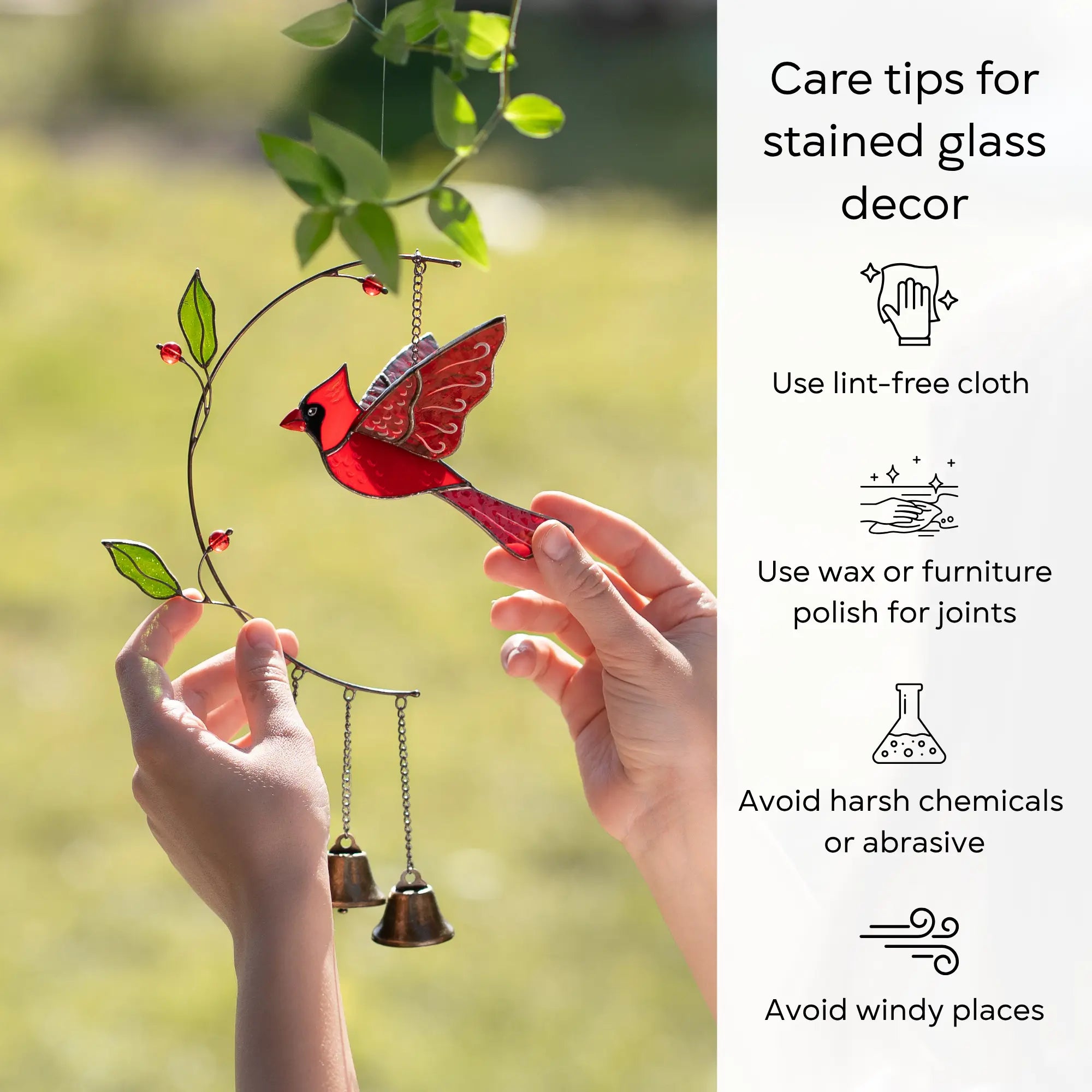 Cardinal bird stained glass wind chime held by hands with care tips on the right: use lint-free cloth, polish joints with car wax or furniture polish, avoid harsh chemicals, and windy places.