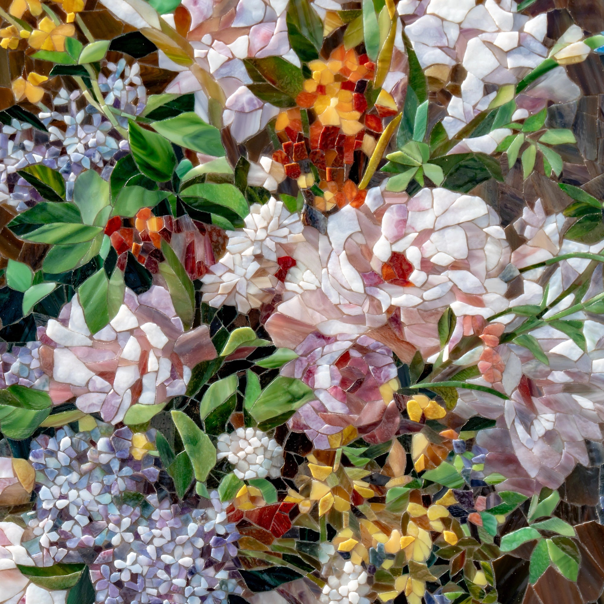 Stained glass mosaic detail showing roses and wildflowers in pastel shades, surrounded by green leaves, inspired by Renoir’s expressive spring floral compositions.