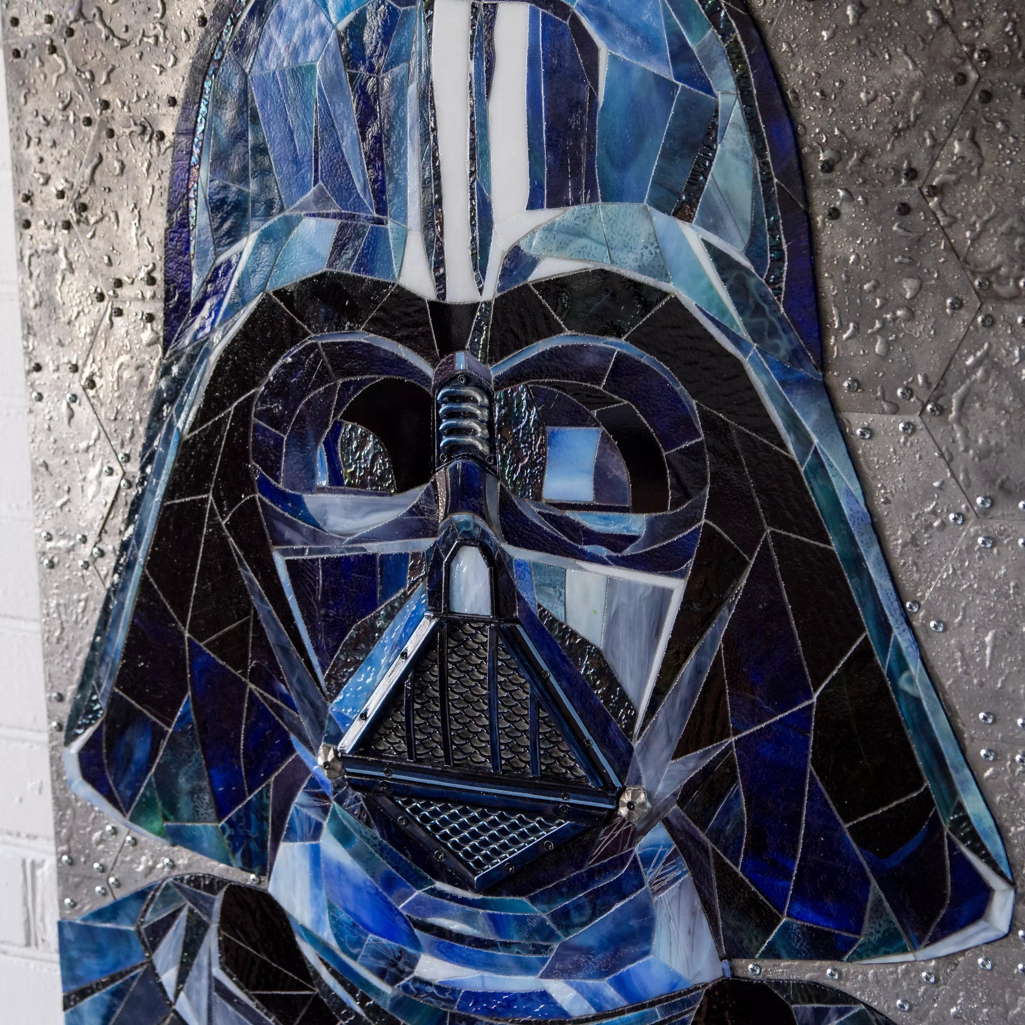 Side perspective of Darth Vader’s face and helmet, highlighting stained glass reflections.