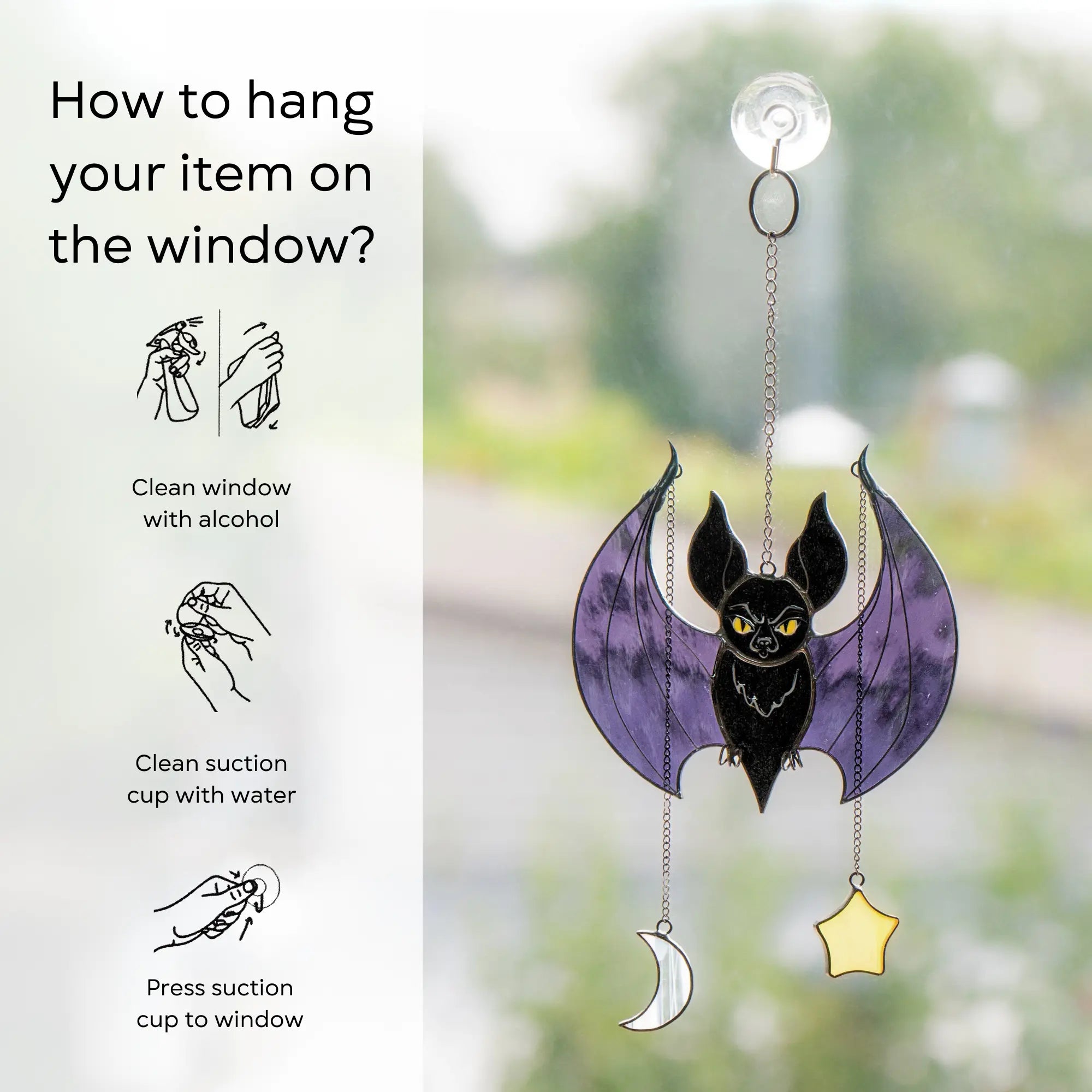 Glass bat decoration with instructions on how to hang it on a window: clean window and suction cup, press a cup to the surface