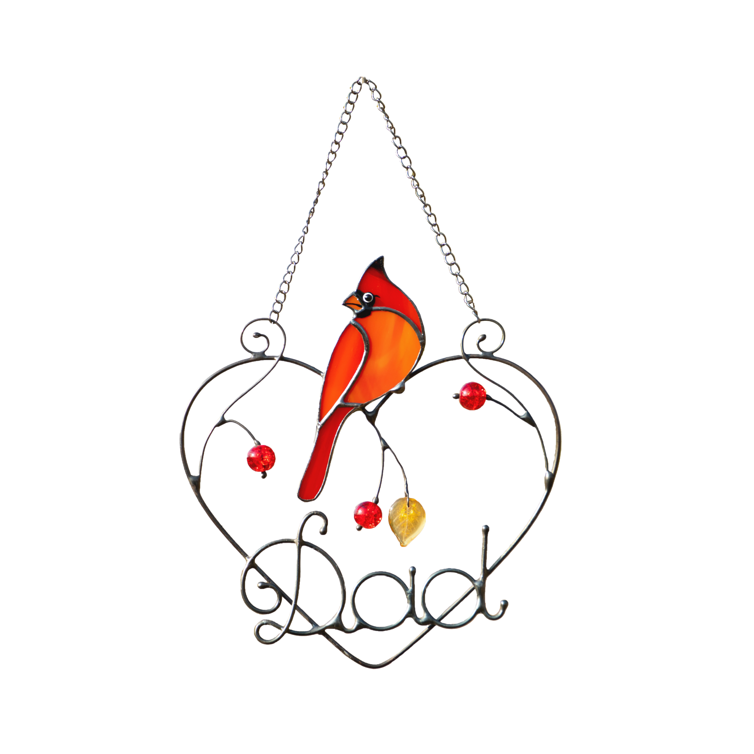 Orange-red stained glass cardinal in heart-shaped metal frame with the word “Dad” and red beads.