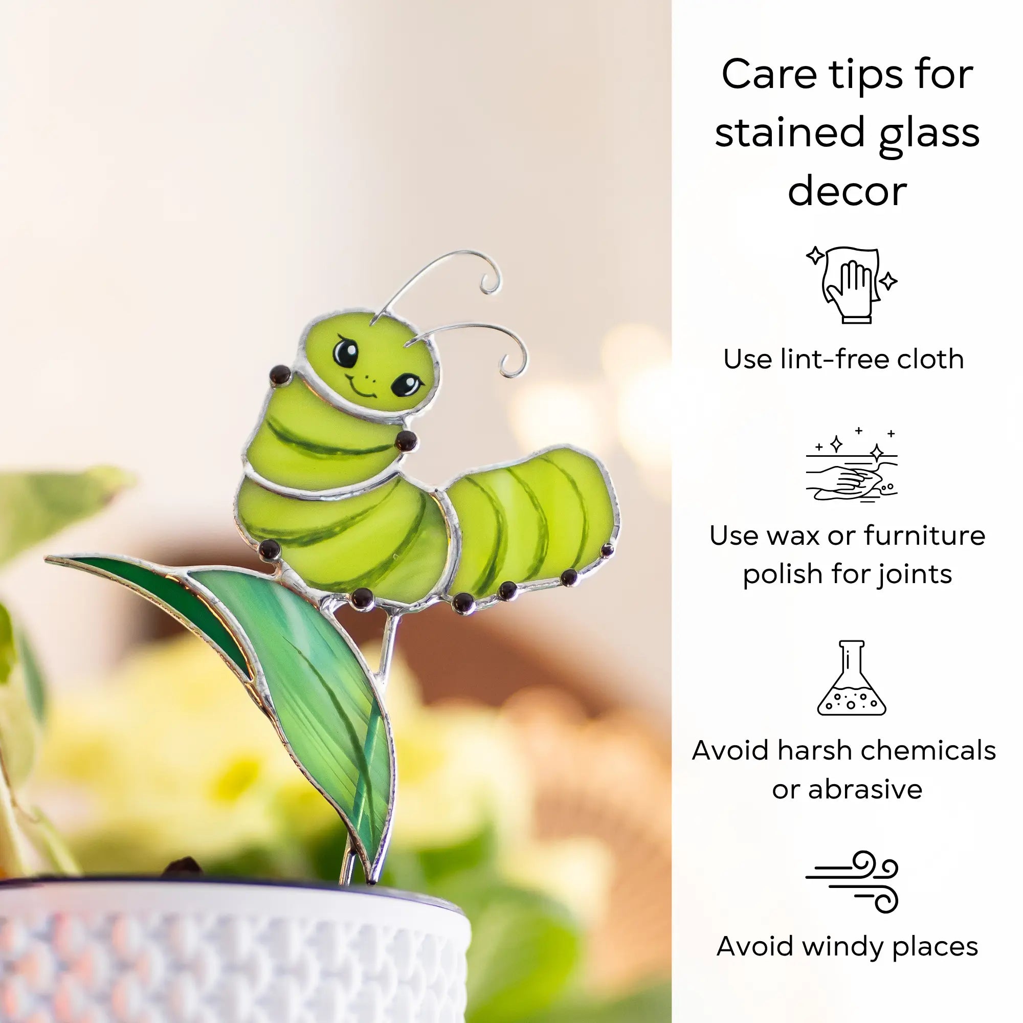 Stained glass caterpillar plant sstake on a leaf with care tips on the right side: use lint-free cloth, polish joints with car wax or furniture polish, avoid harsh chemicals, and windy places.