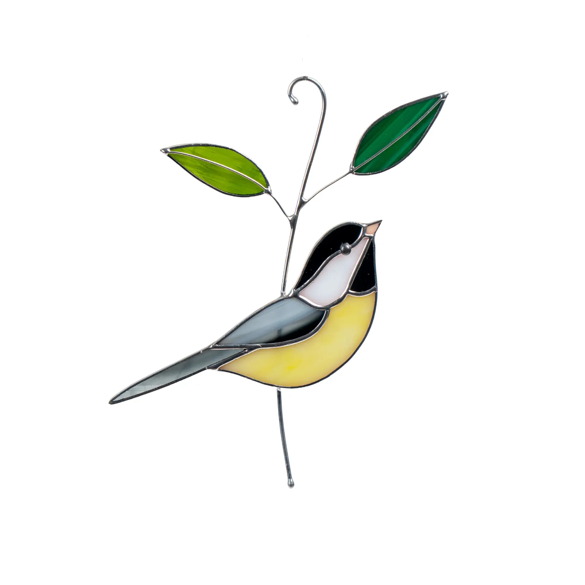Stained glass black-capped chickadee bird on a branch with leaves on a white background