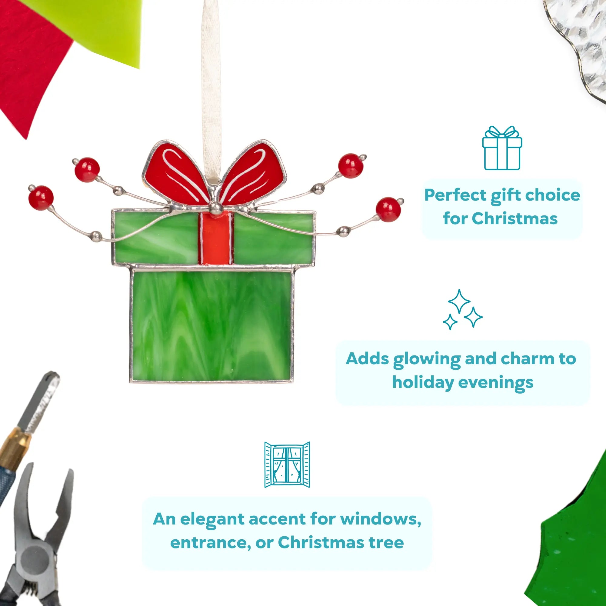 Stained glass green gift box with a red ribbon, adorned with small red beads and silver wire.