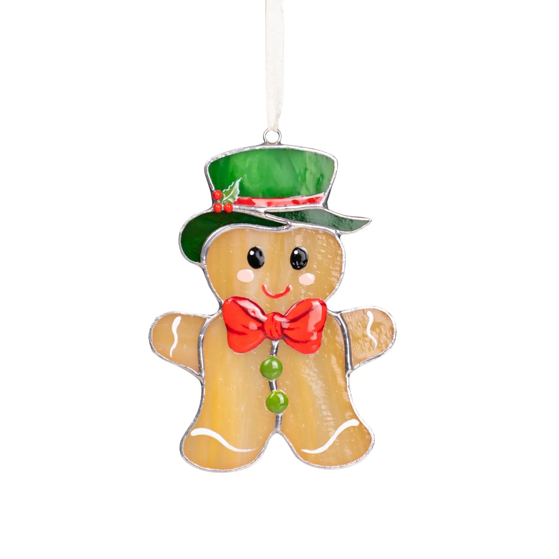 Gingerbread man stained glass suncatcher with shiny green hat, red bow tie, and holly detail on white background.