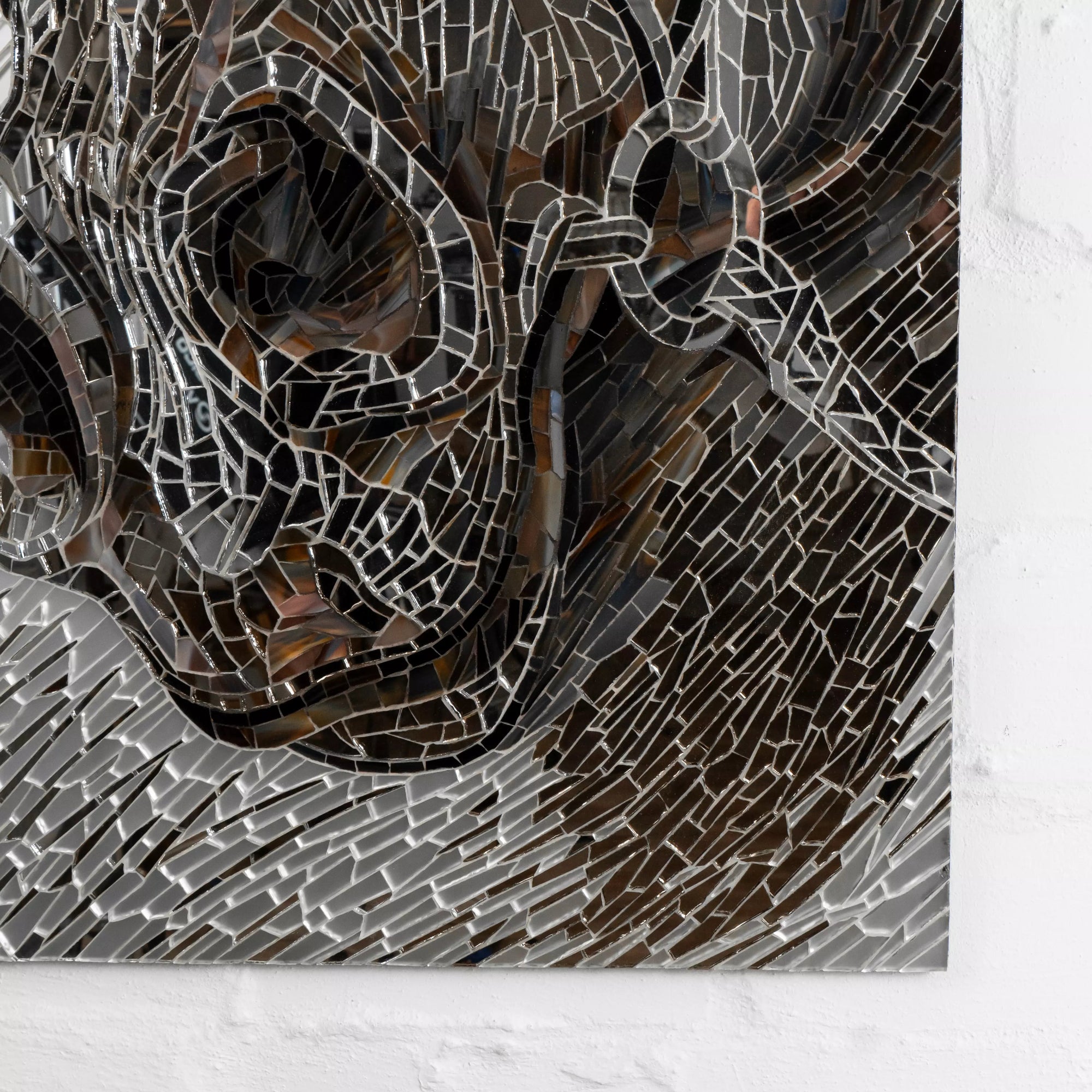 Detailed view of a mosaic horse’s nose and halter made of dark and mirror-like tiles