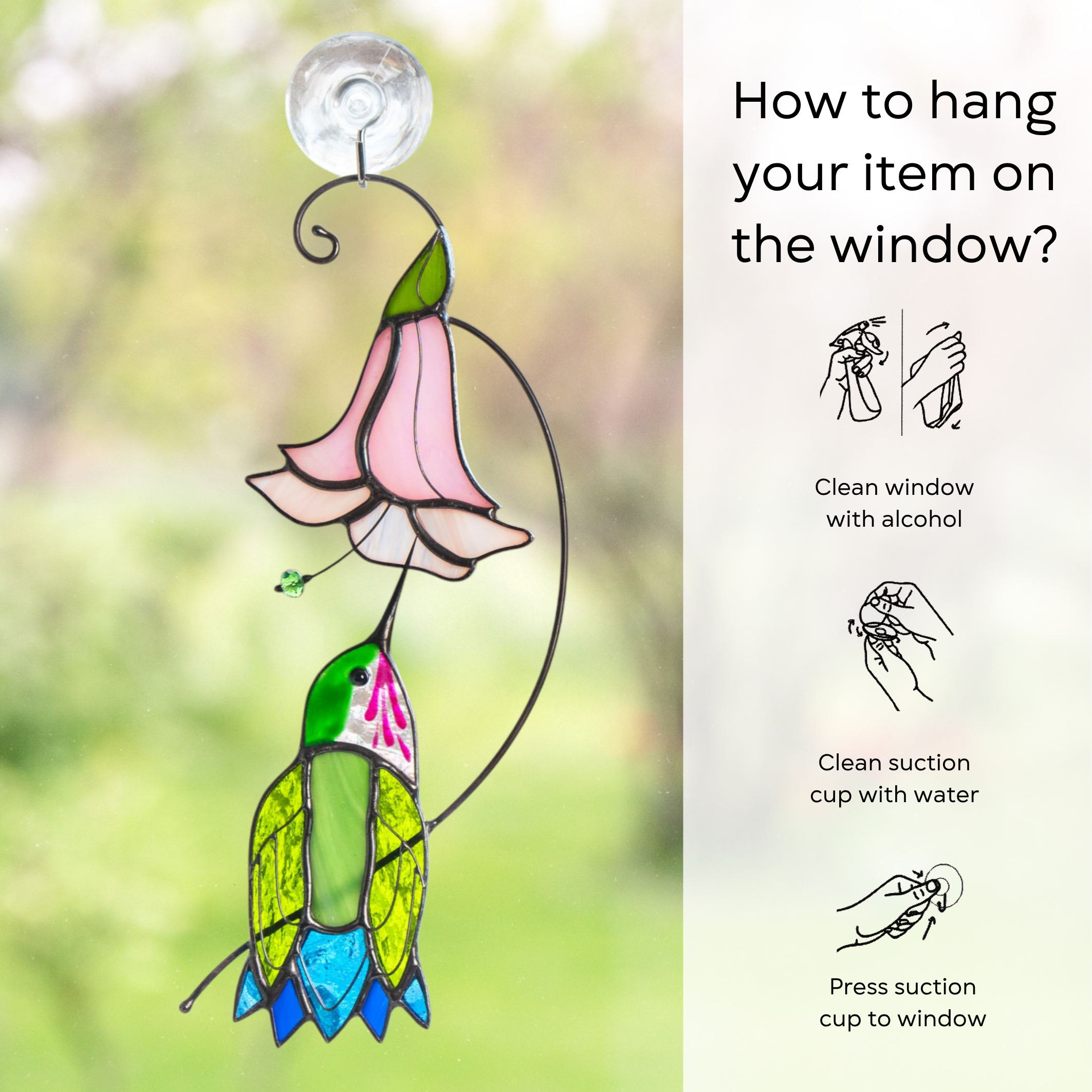 How-to infographic showing a hummingbird suncatcher attached to a window, with illustrated hanging instructions: clean window and suction cup, press a cup to the surface.