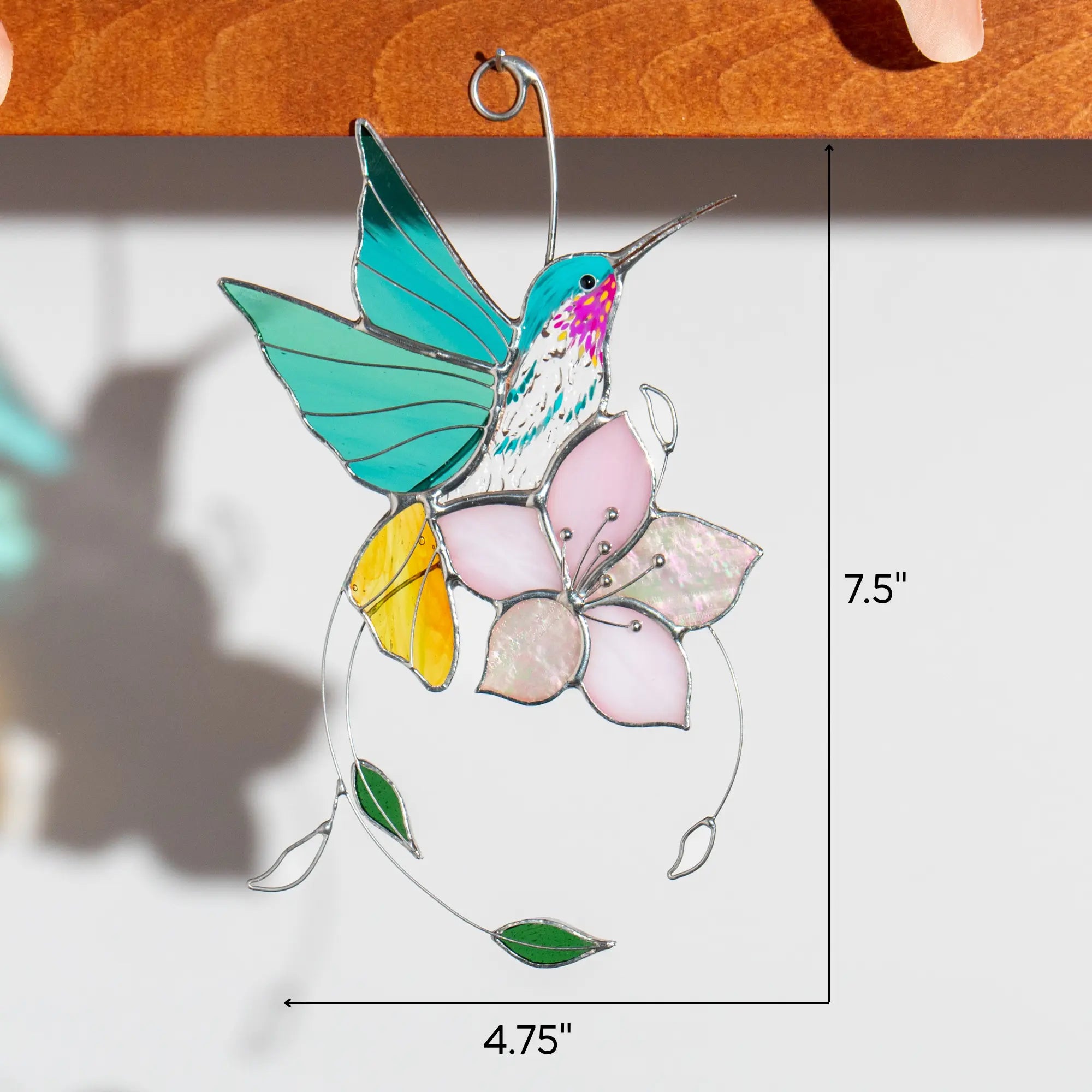 Stained glass hummingbird suncatcher with sakura and marked dimensions: 7.5 x 4.75 inches